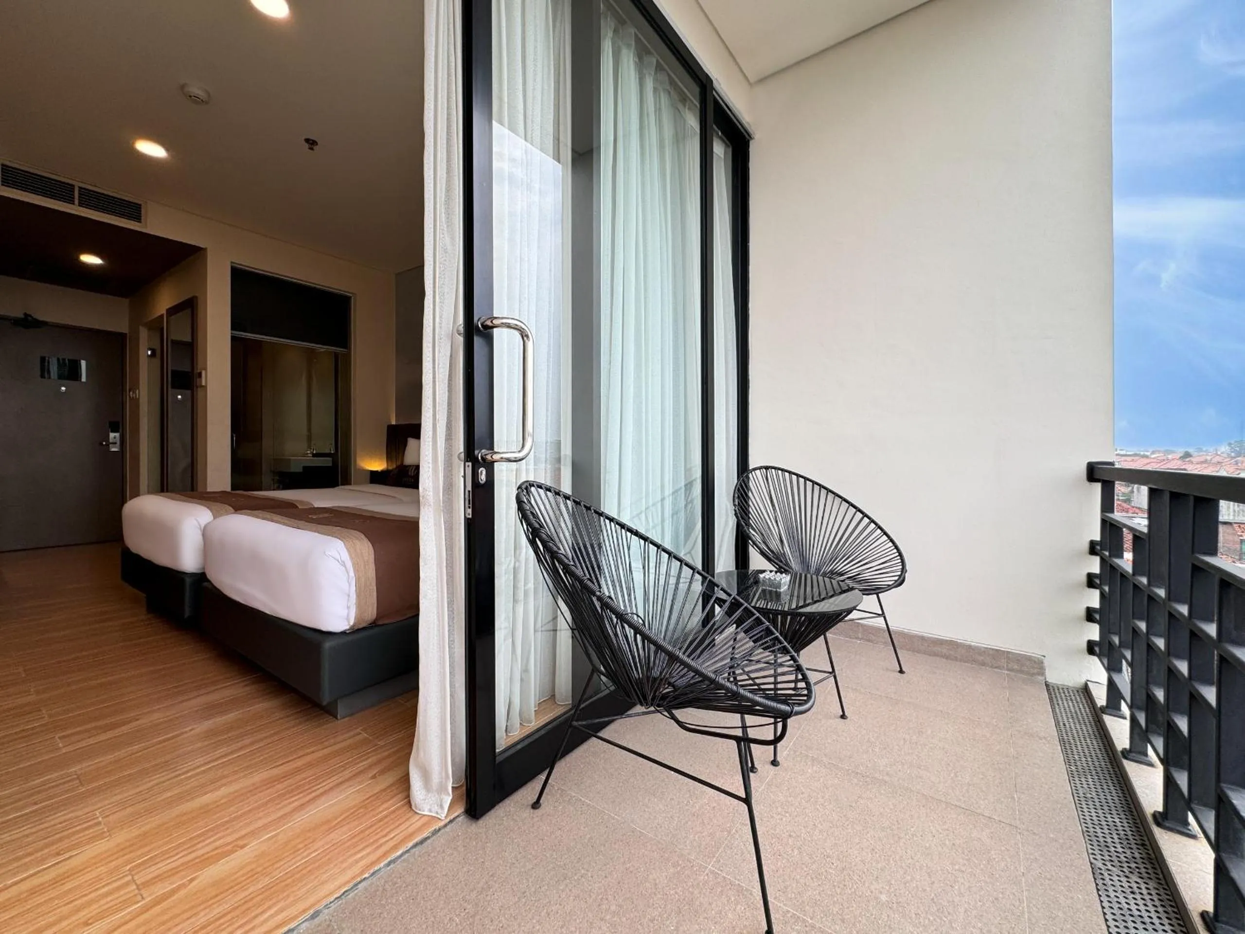 Balcony/Terrace, Bed in Aveon Hotel Yogyakarta by Daphna Management