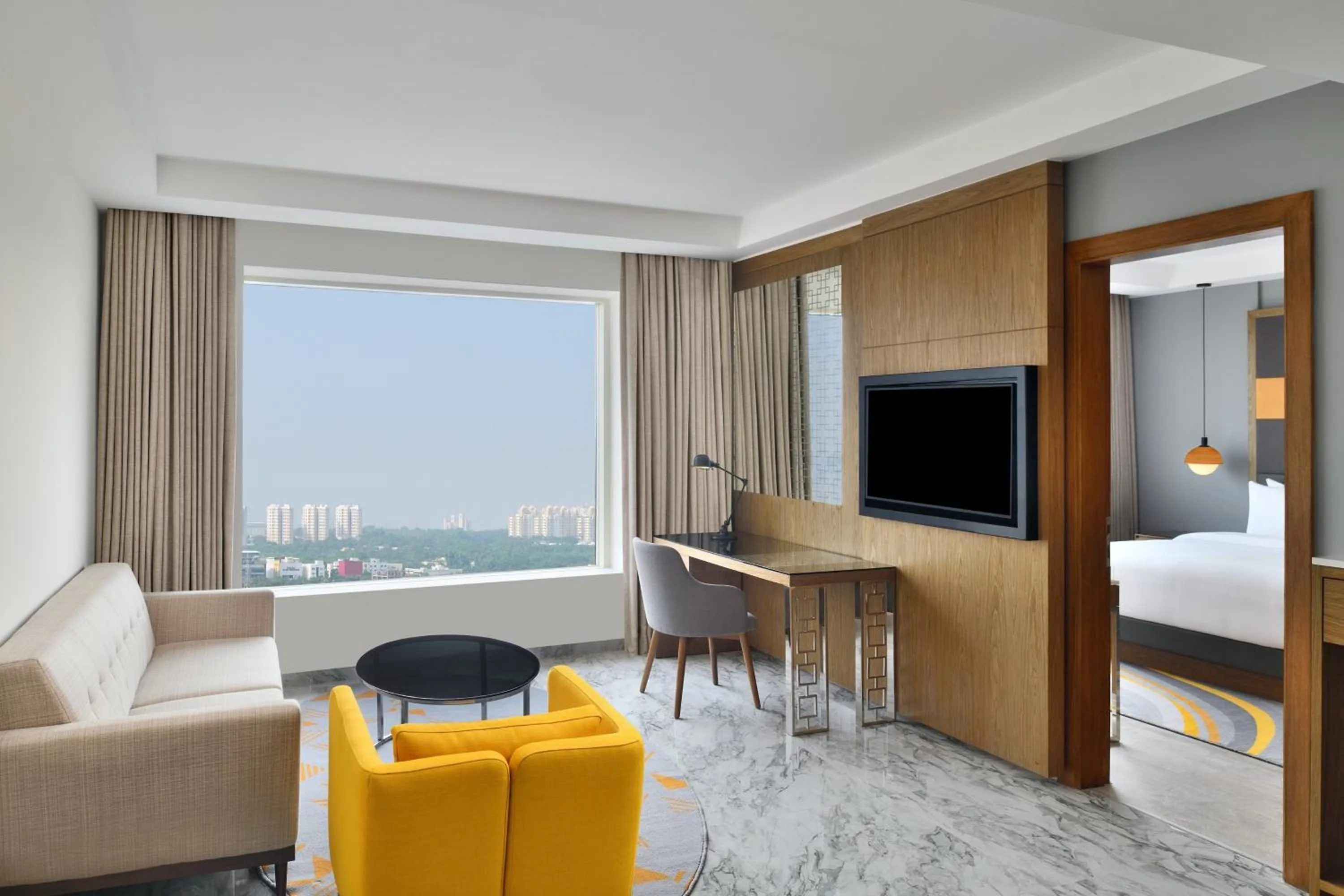 Living room, Bed in Le Meridien Hyderabad