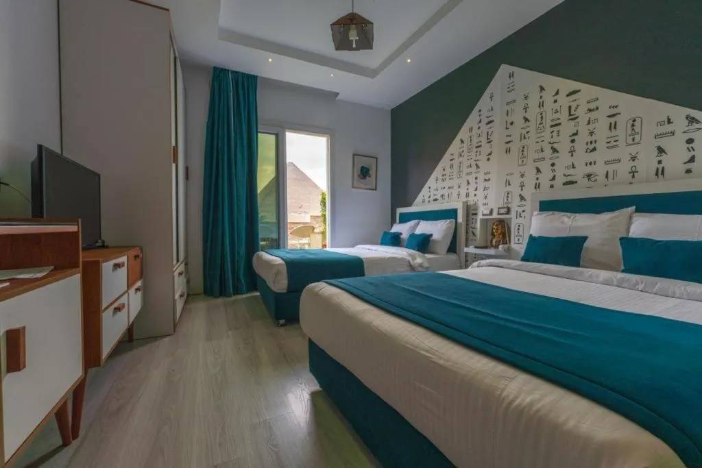Bed in Elite Pyramids Boutique Hotel