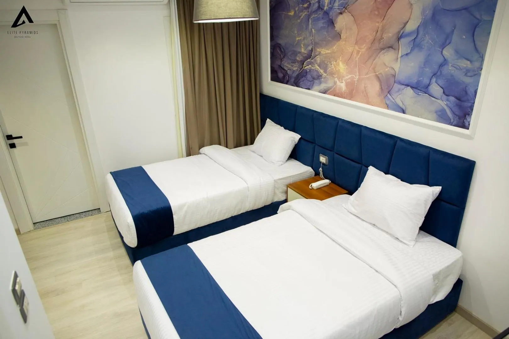 Bed in Elite Pyramids Boutique Hotel