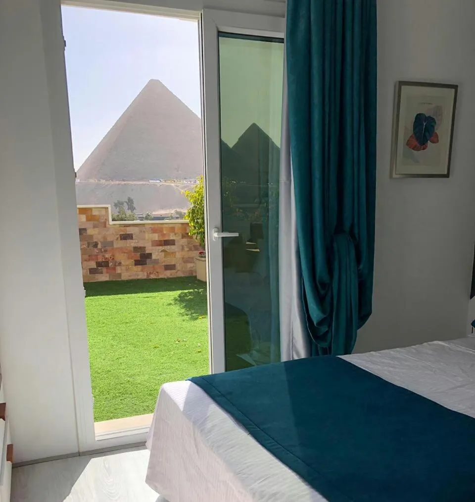 Bed in Elite Pyramids Boutique Hotel