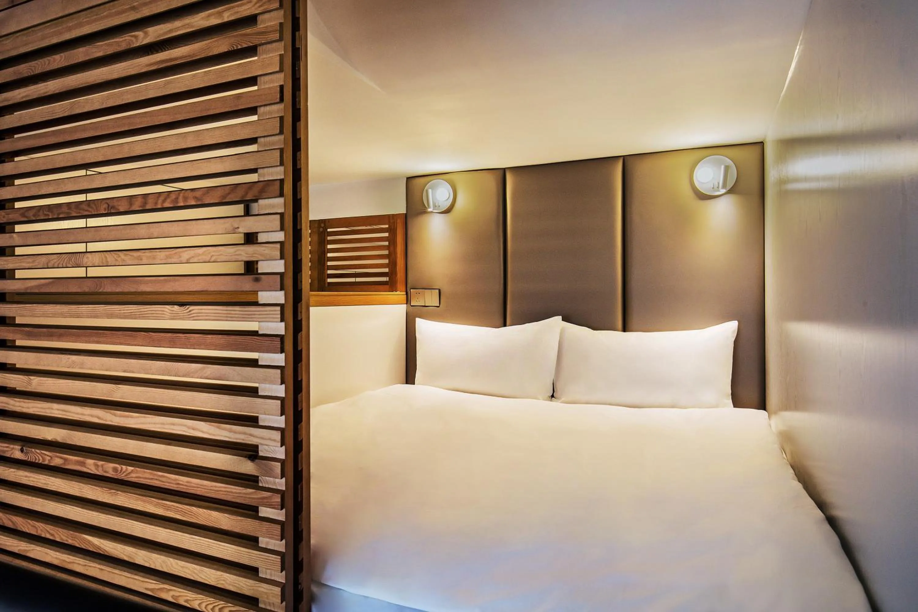 Bed in Livefortuna Hotel