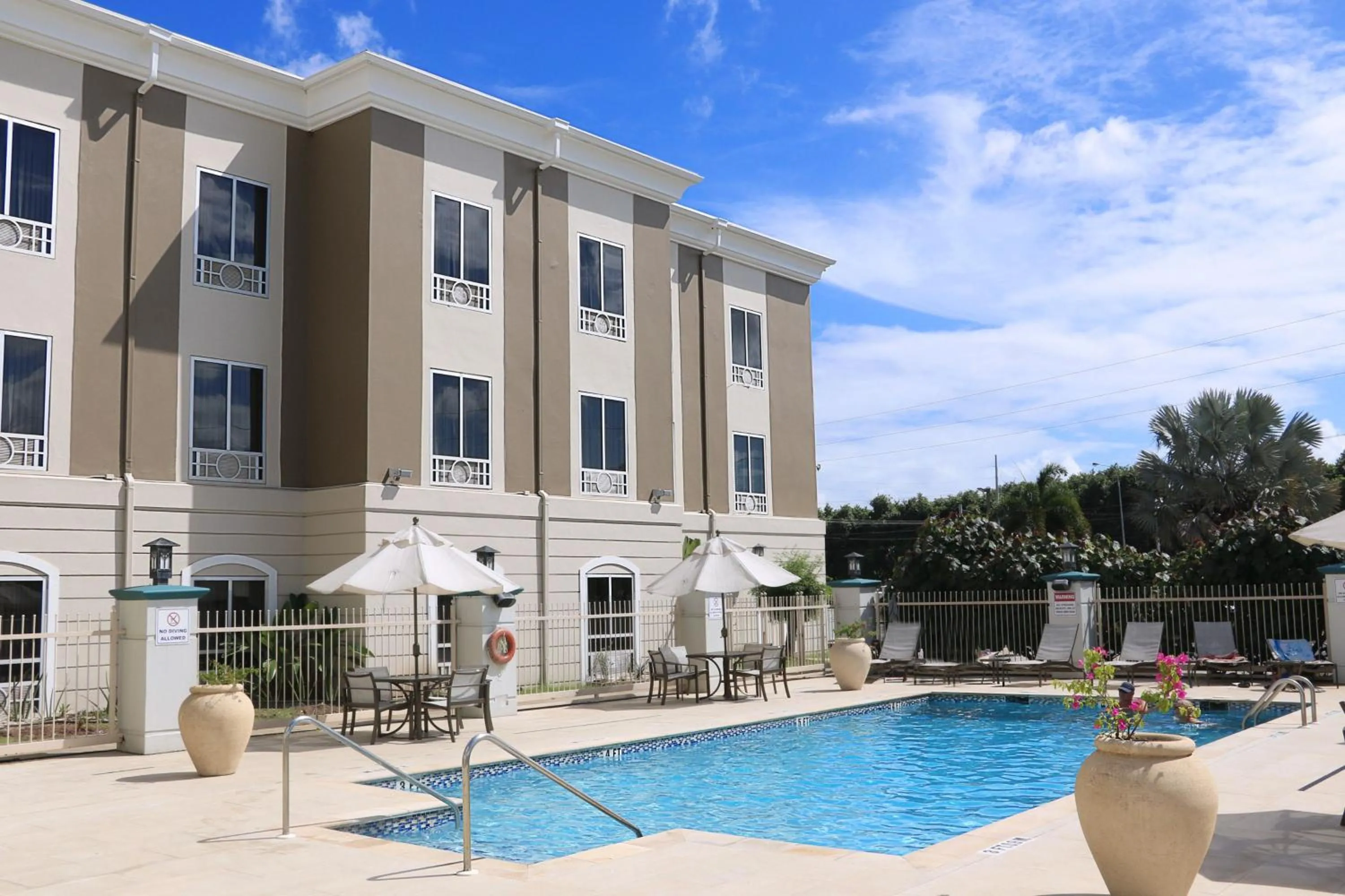 Swimming pool in Holiday Inn Express Trincity by IHG