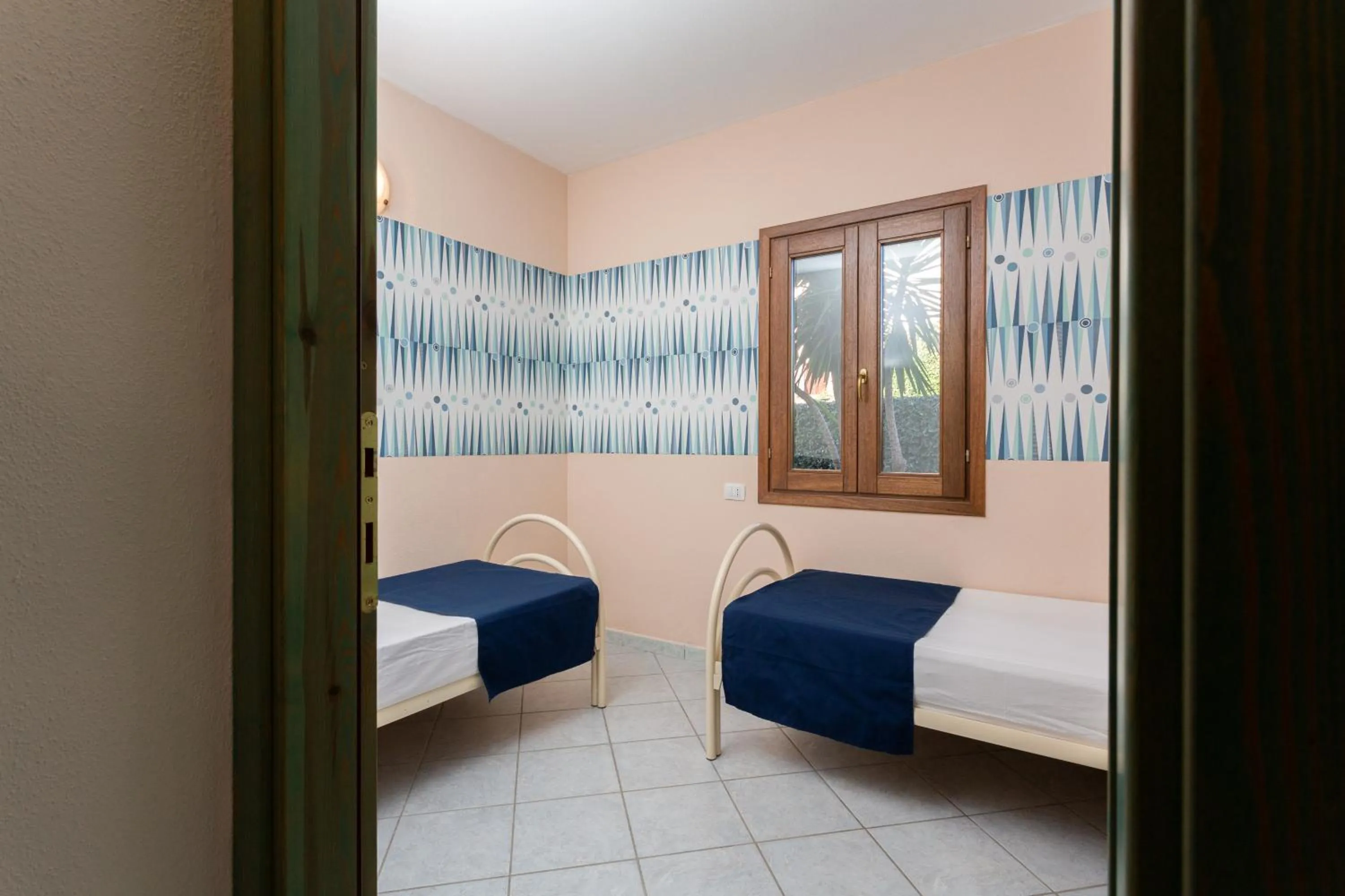 Bed in Appartamenti Tanaunella