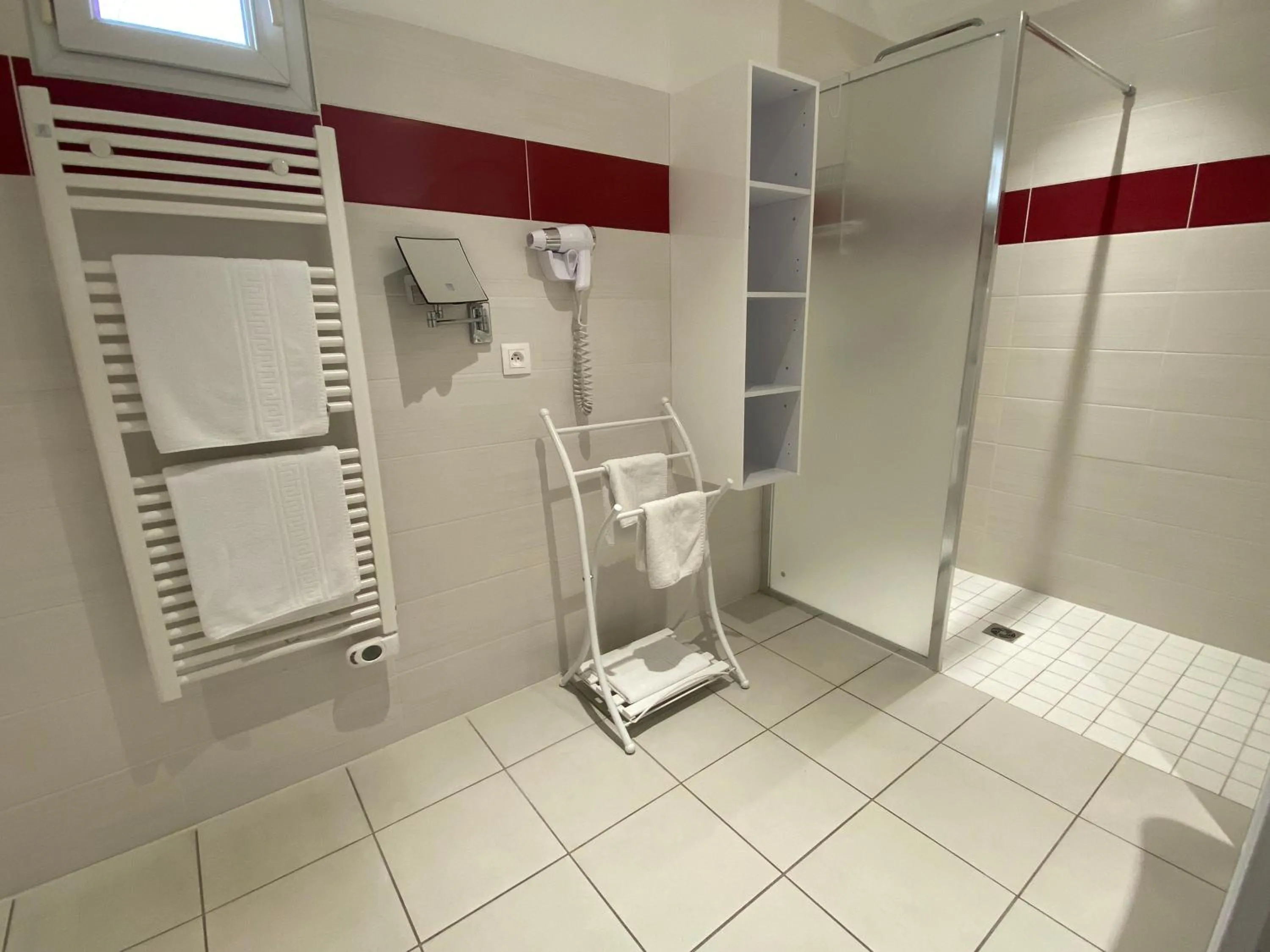 Bathroom in Contact hôtel - Hôtel Les Bleuets & SPA