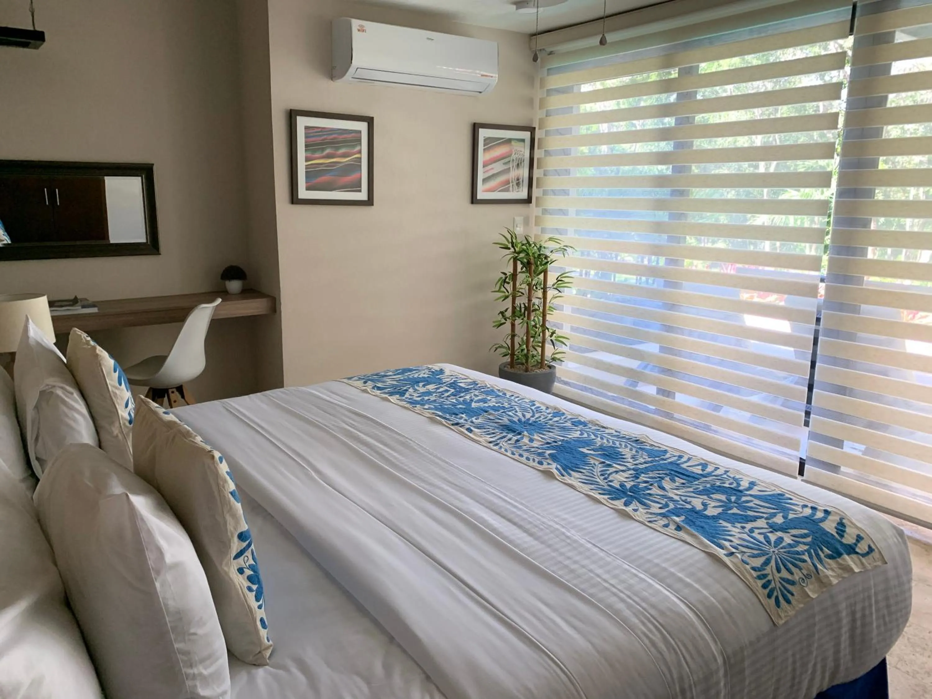 Bed in Xaha Villas Suites & Golf Resort