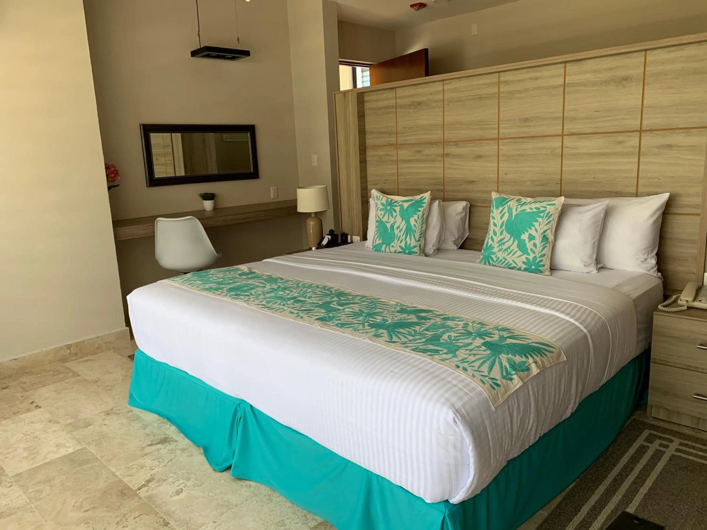 Bed in Xaha Villas Suites & Golf Resort
