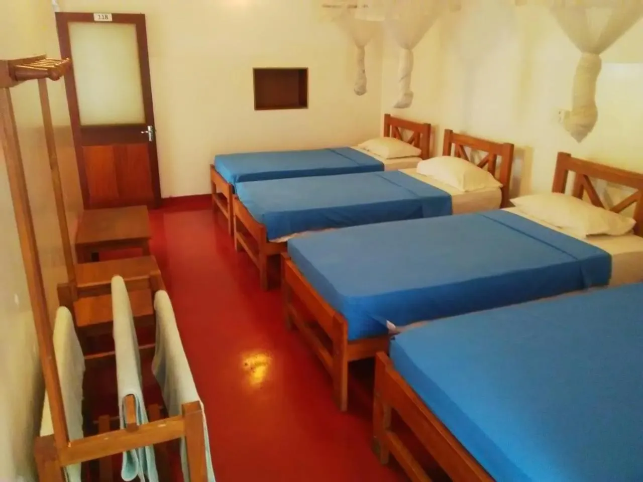 Bed in Hotel Mango Garden