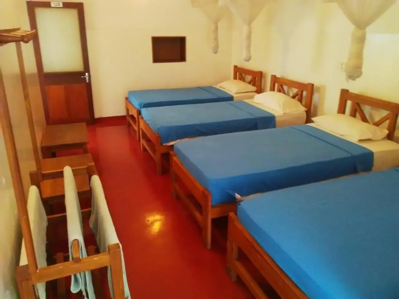 Bed in Hotel Mango Garden