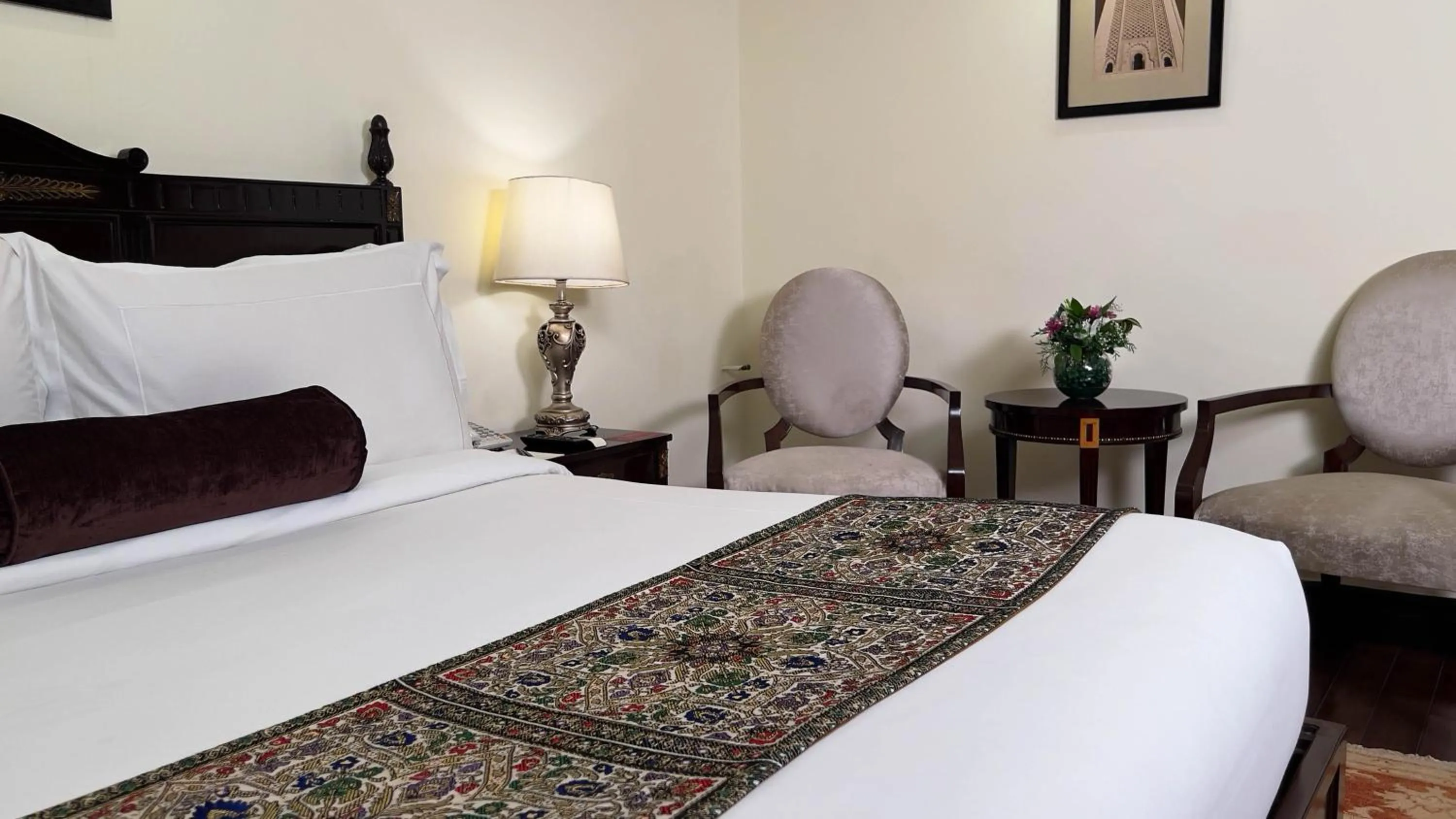 Bed in Heritage Luxury Suites All Suite Hotel