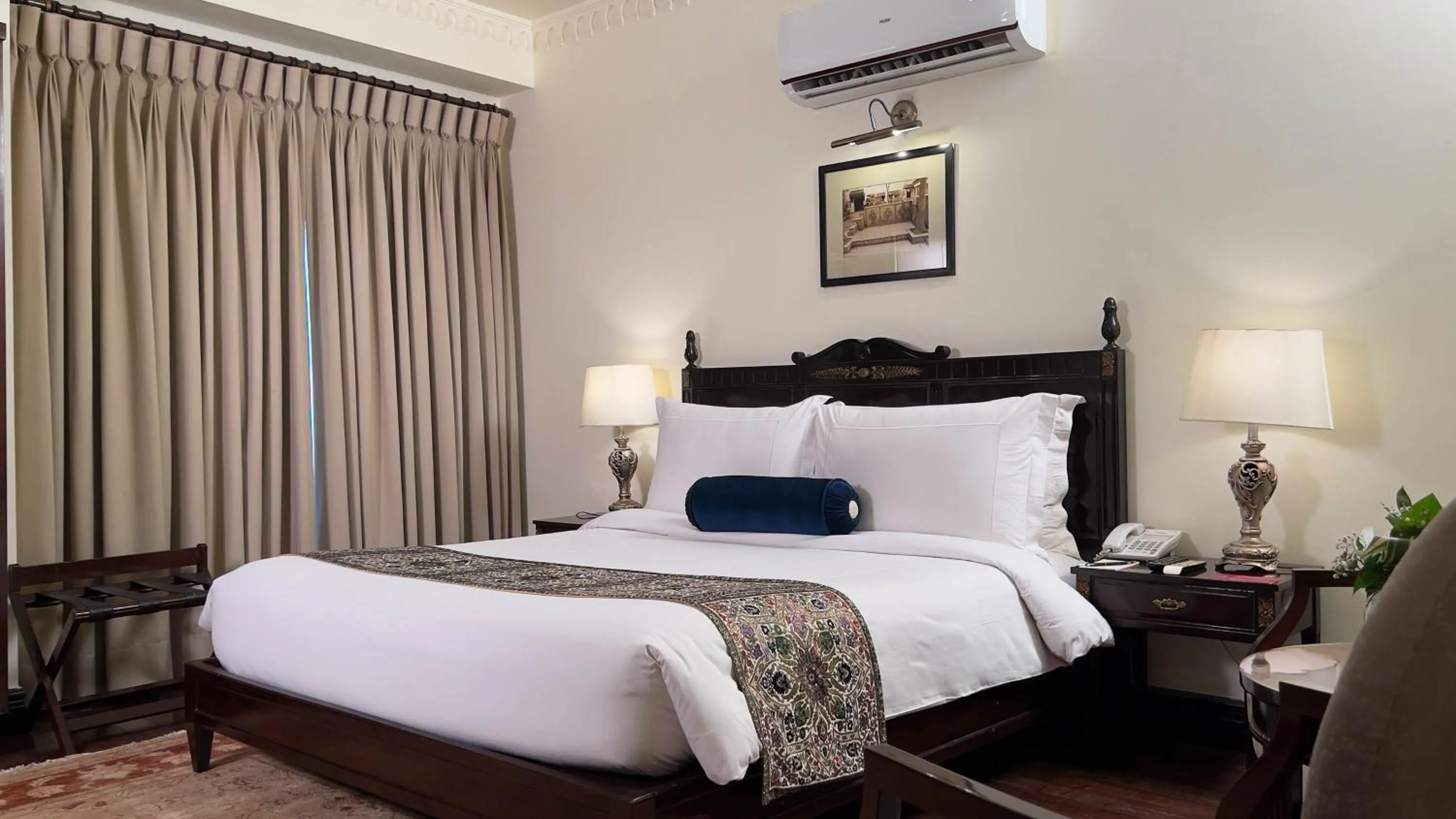 Bed in Heritage Luxury Suites All Suite Hotel