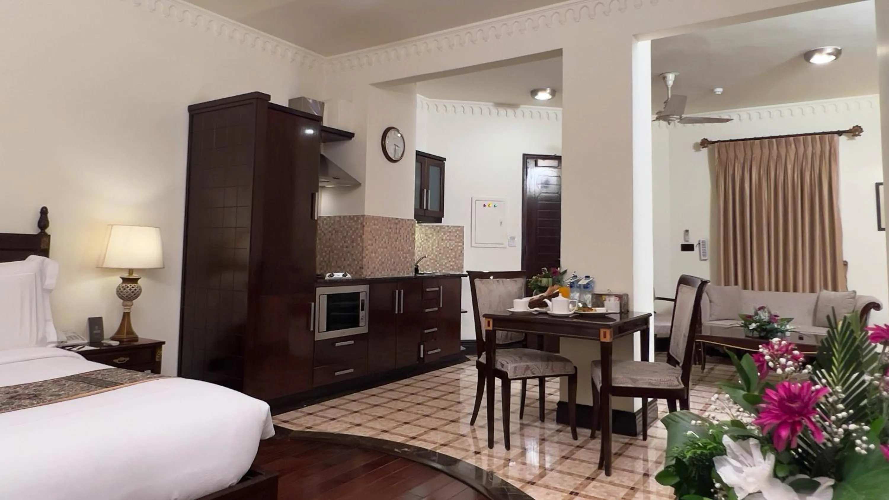 Bed in Heritage Luxury Suites All Suite Hotel