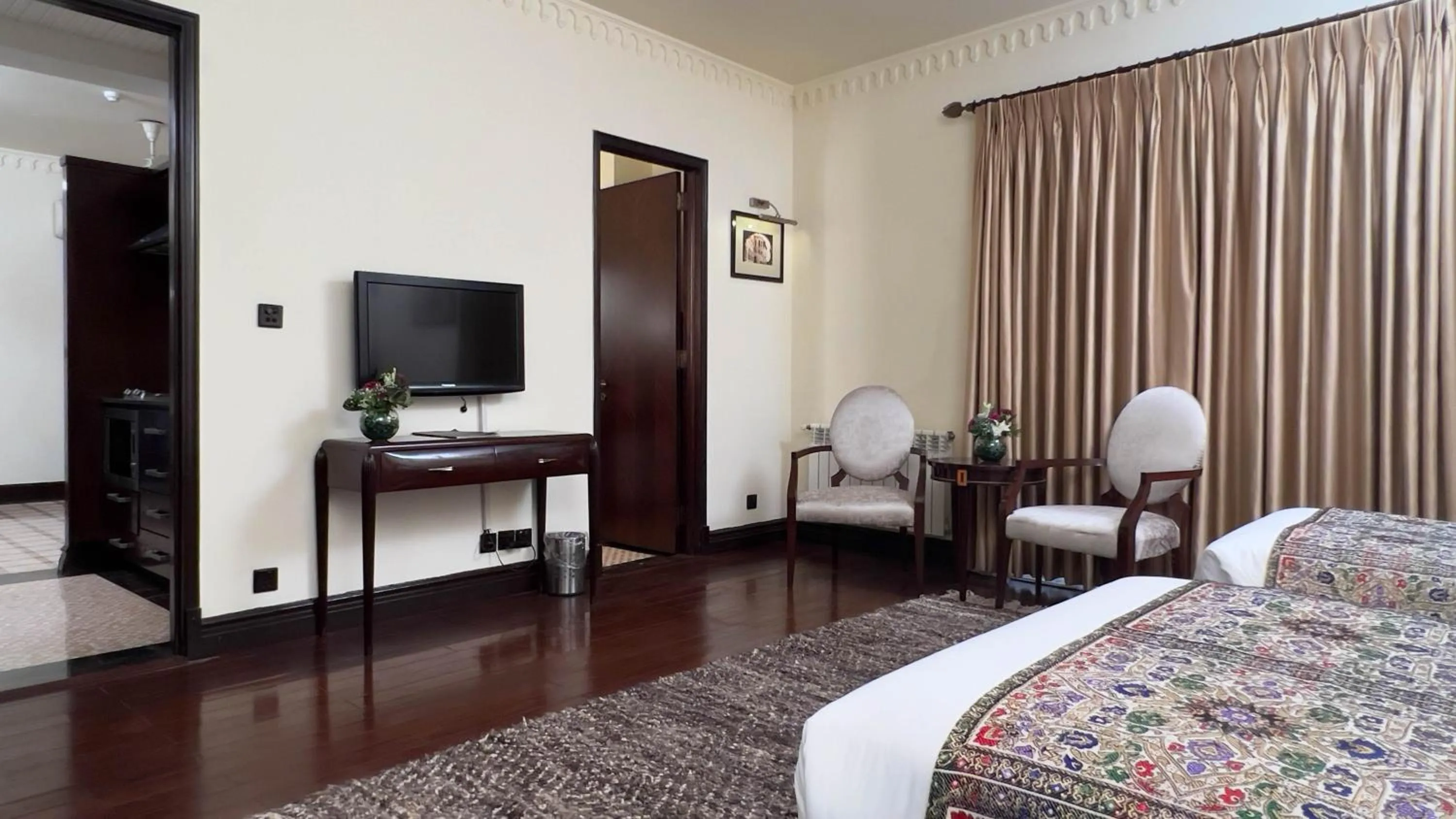 Bed in Heritage Luxury Suites All Suite Hotel