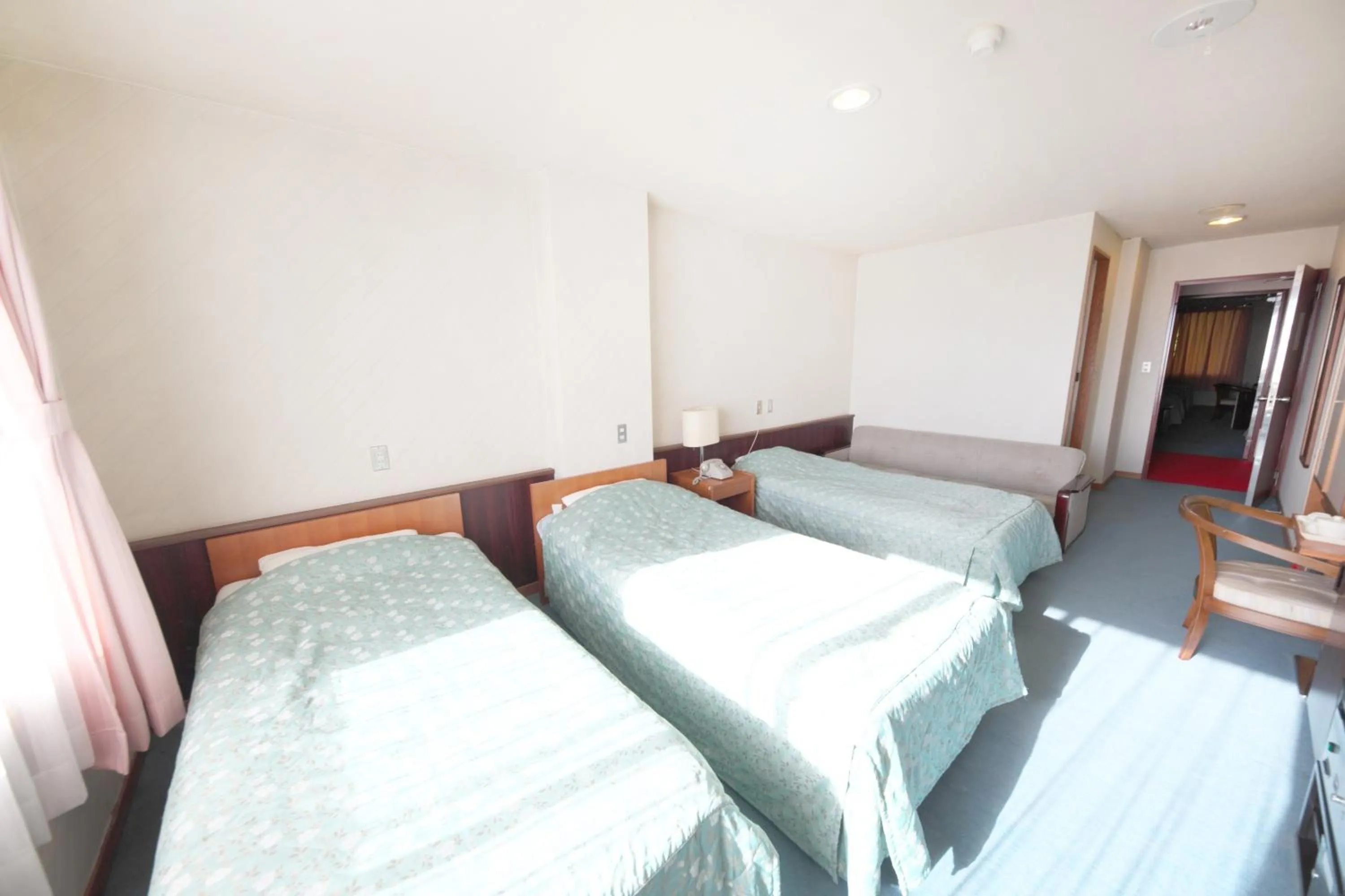 Photo of the whole room, Bed in Shiga Swiss Inn