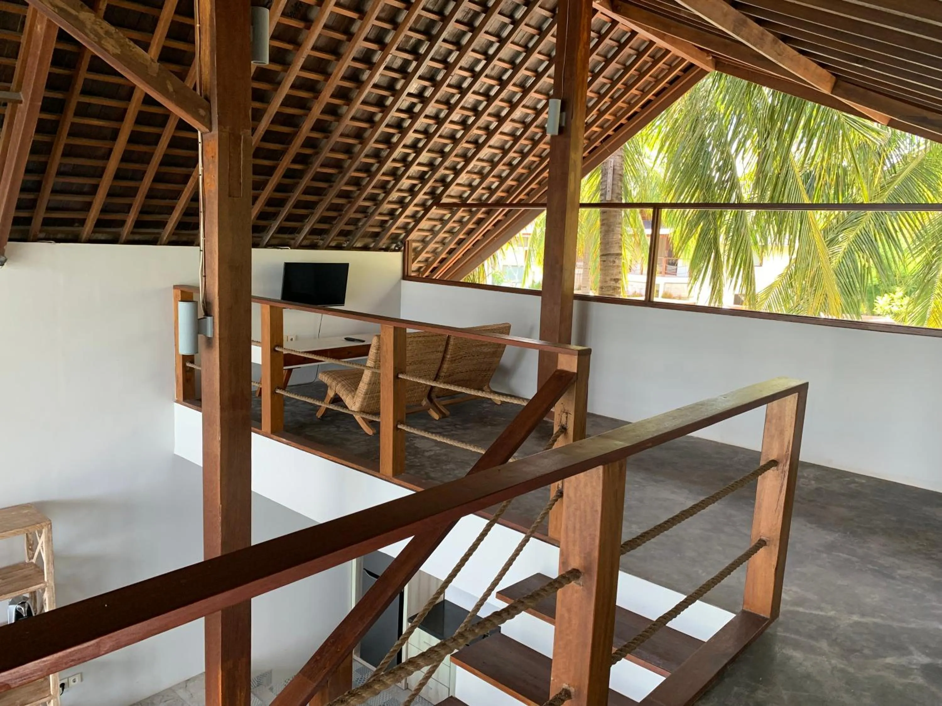 Communal lounge/ TV room in The Club Villas Lombok