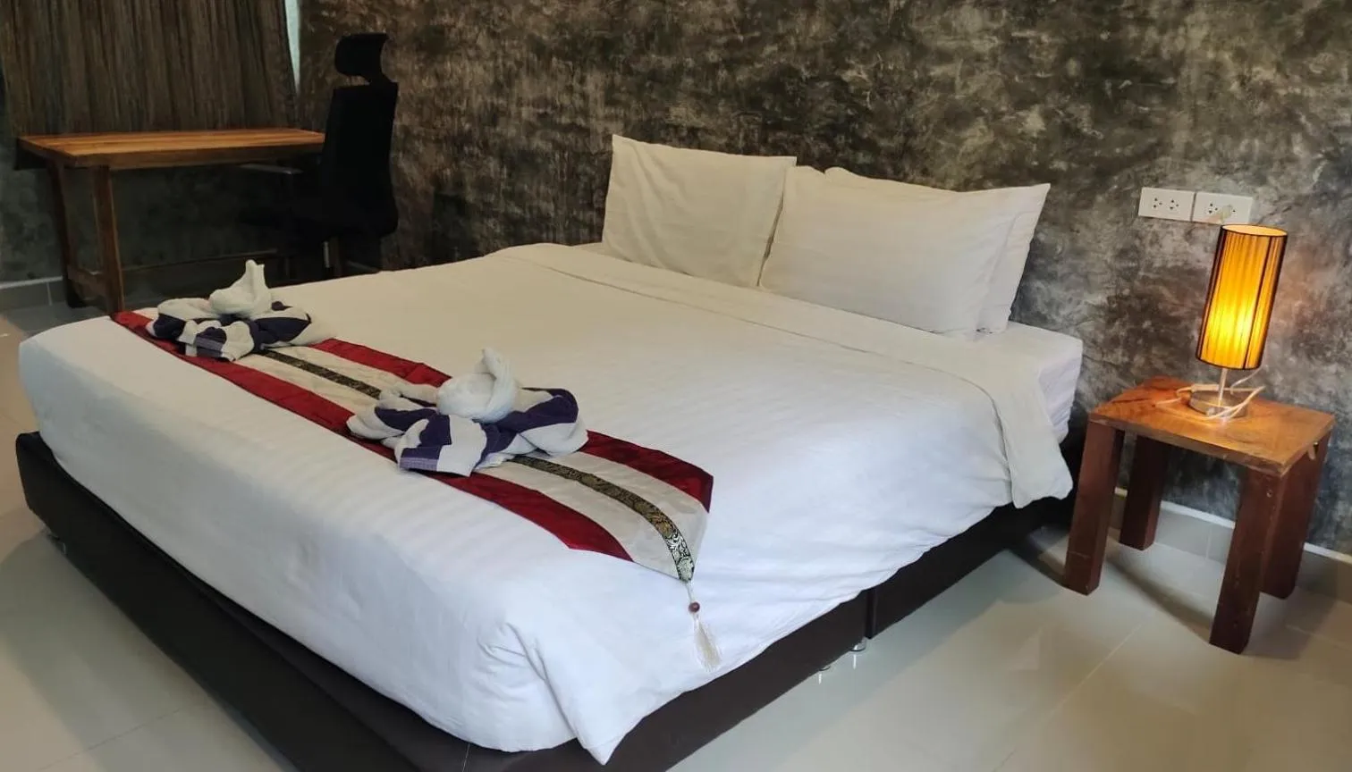 Bed in Le Grand Bleu Hotel