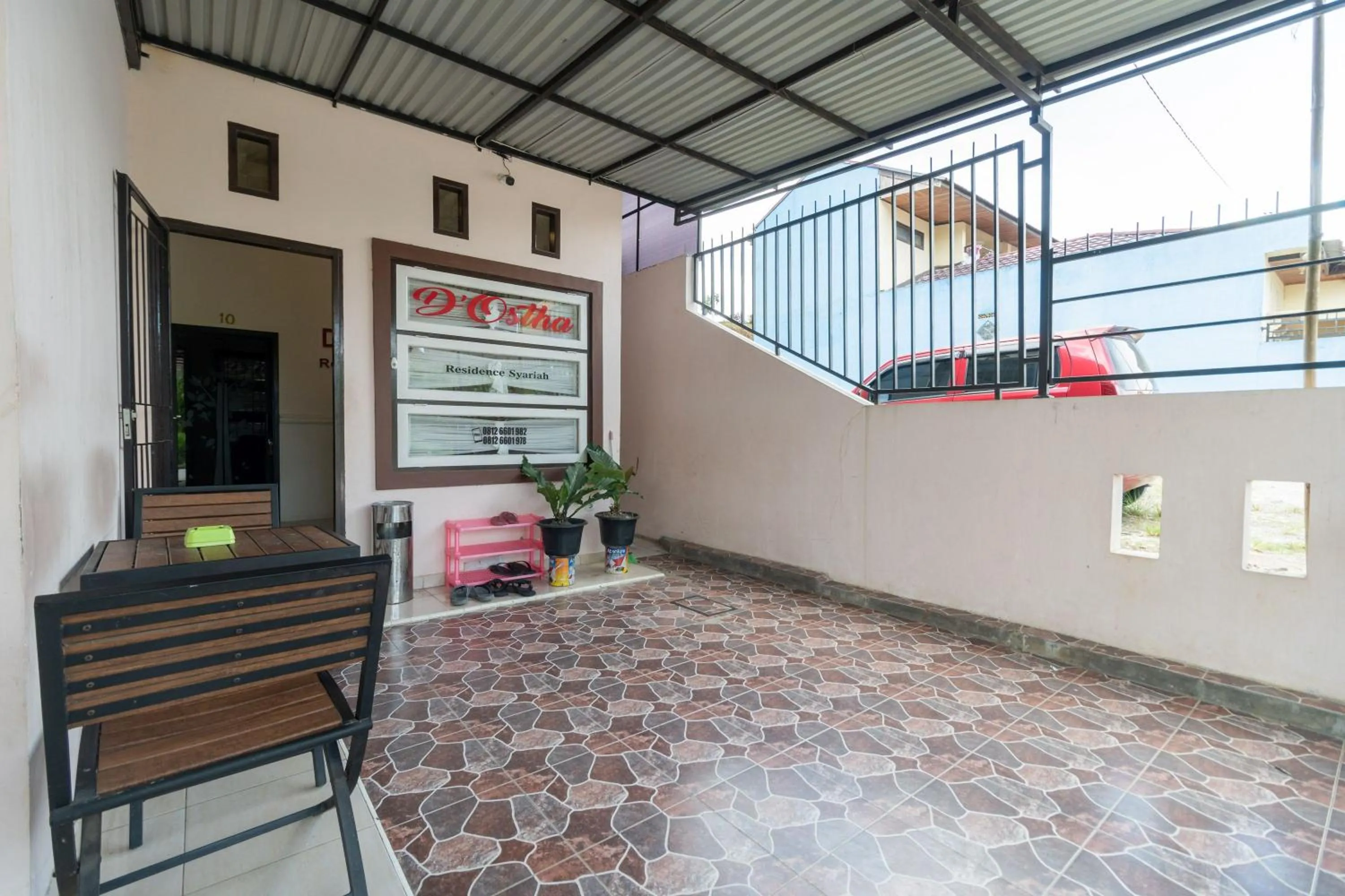 Facade/entrance in RedDoorz Syariah at D'Ostha Residence