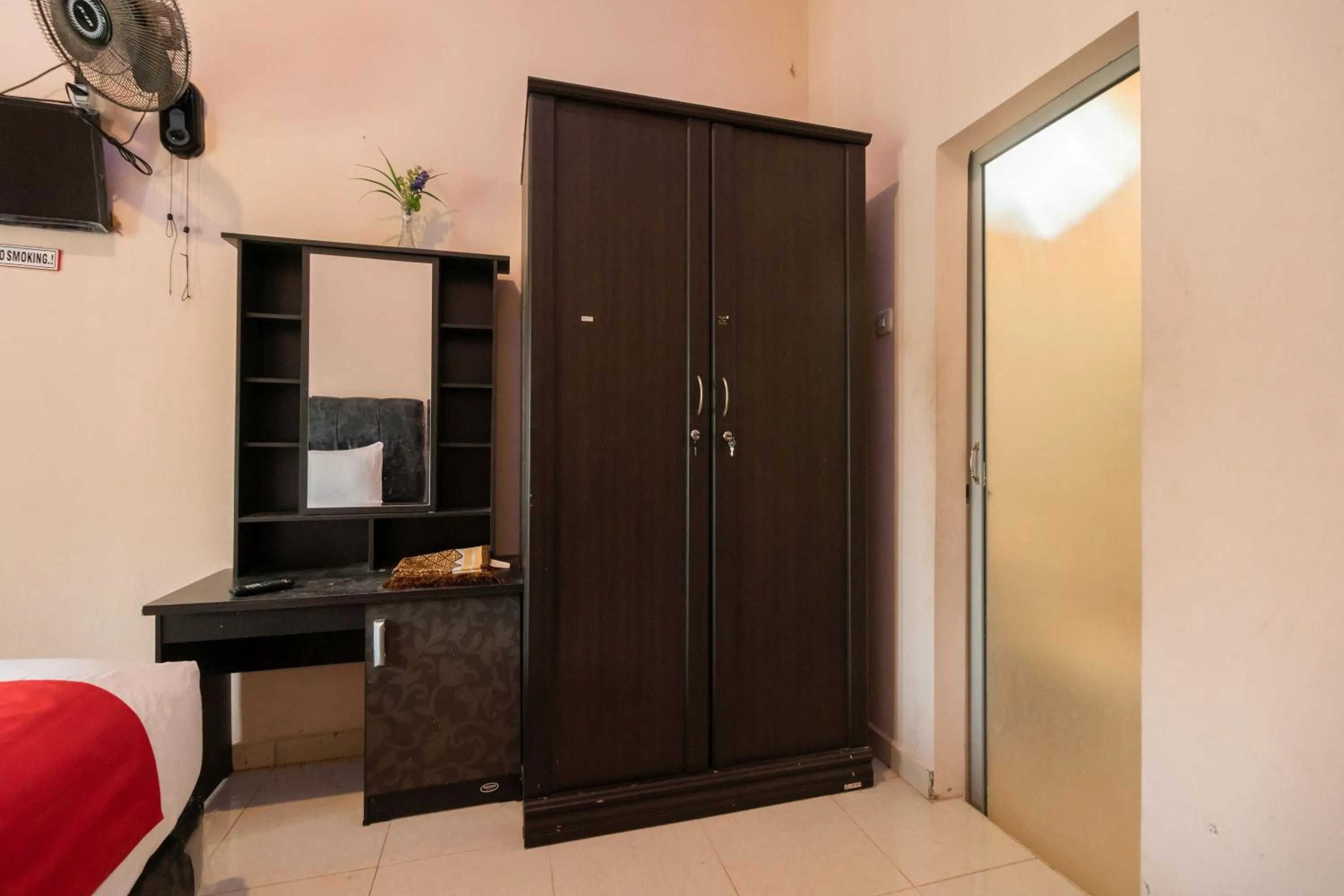 Bedroom in RedDoorz Syariah at D'Ostha Residence