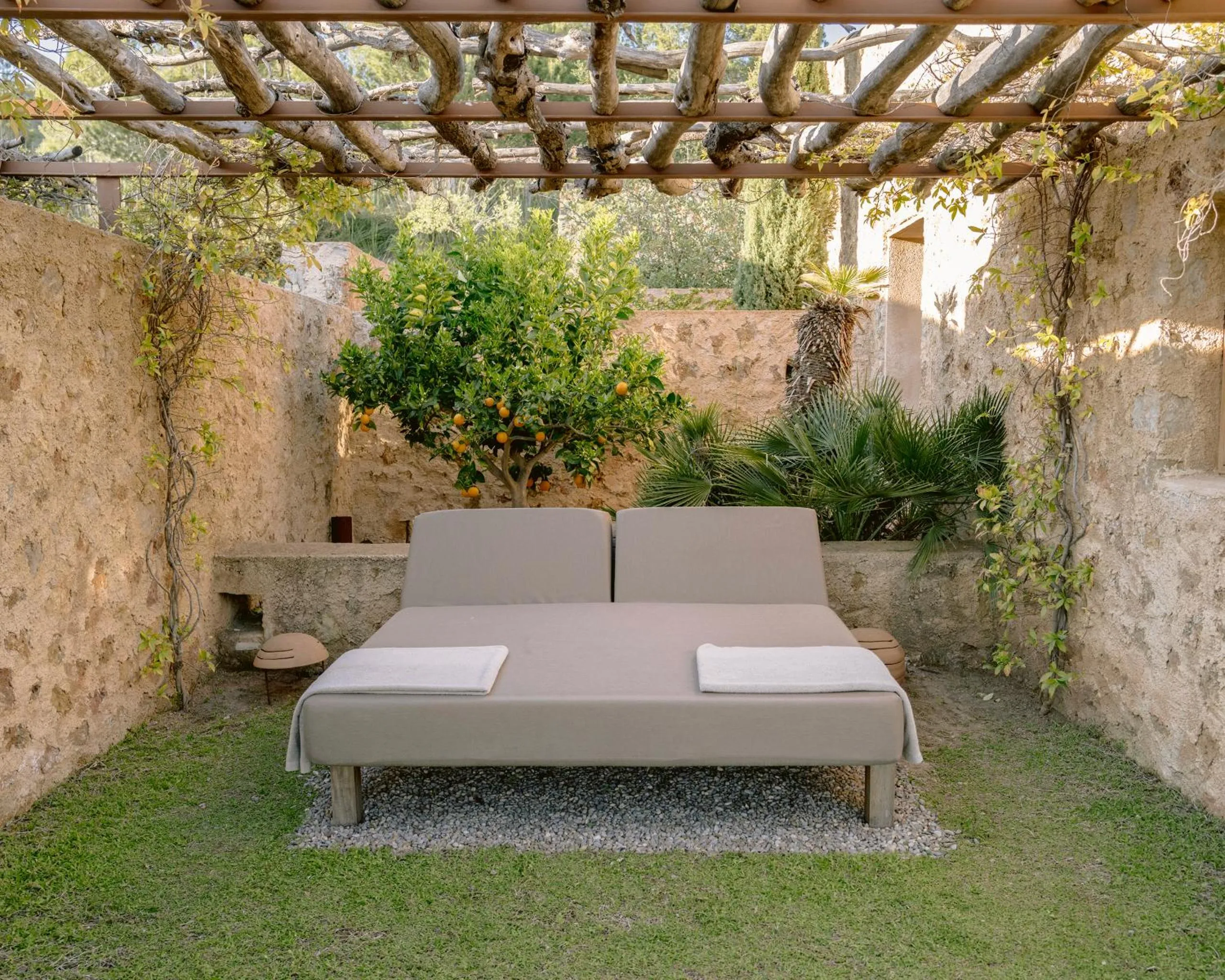 Bed in Es Raco d'Arta, Mallorca, a Member of Design Hotels