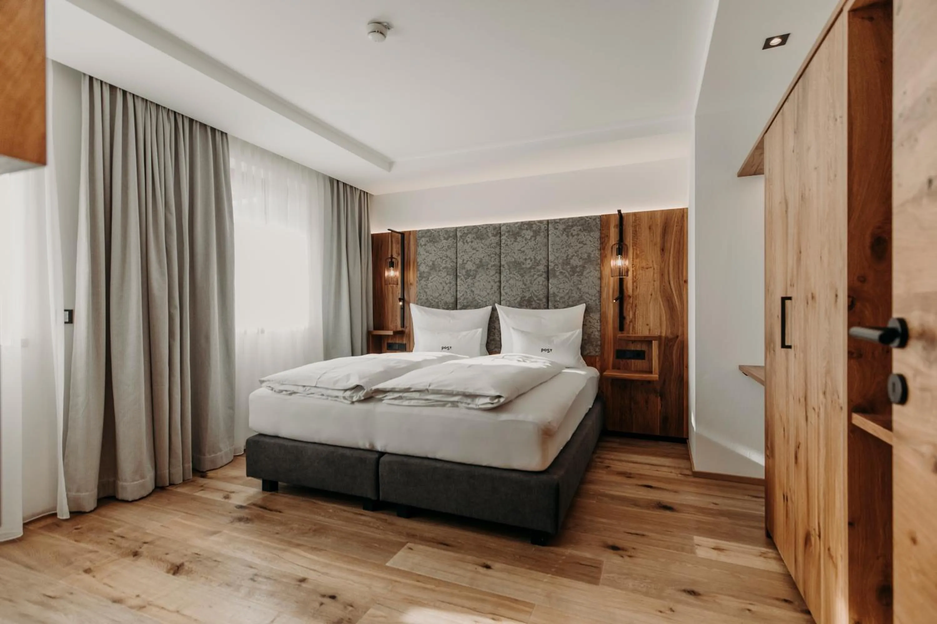 Bed in PoSt Boutique Apartments