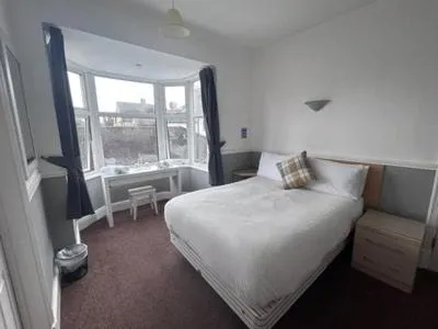 Bed in Charnwood Regency Guest House