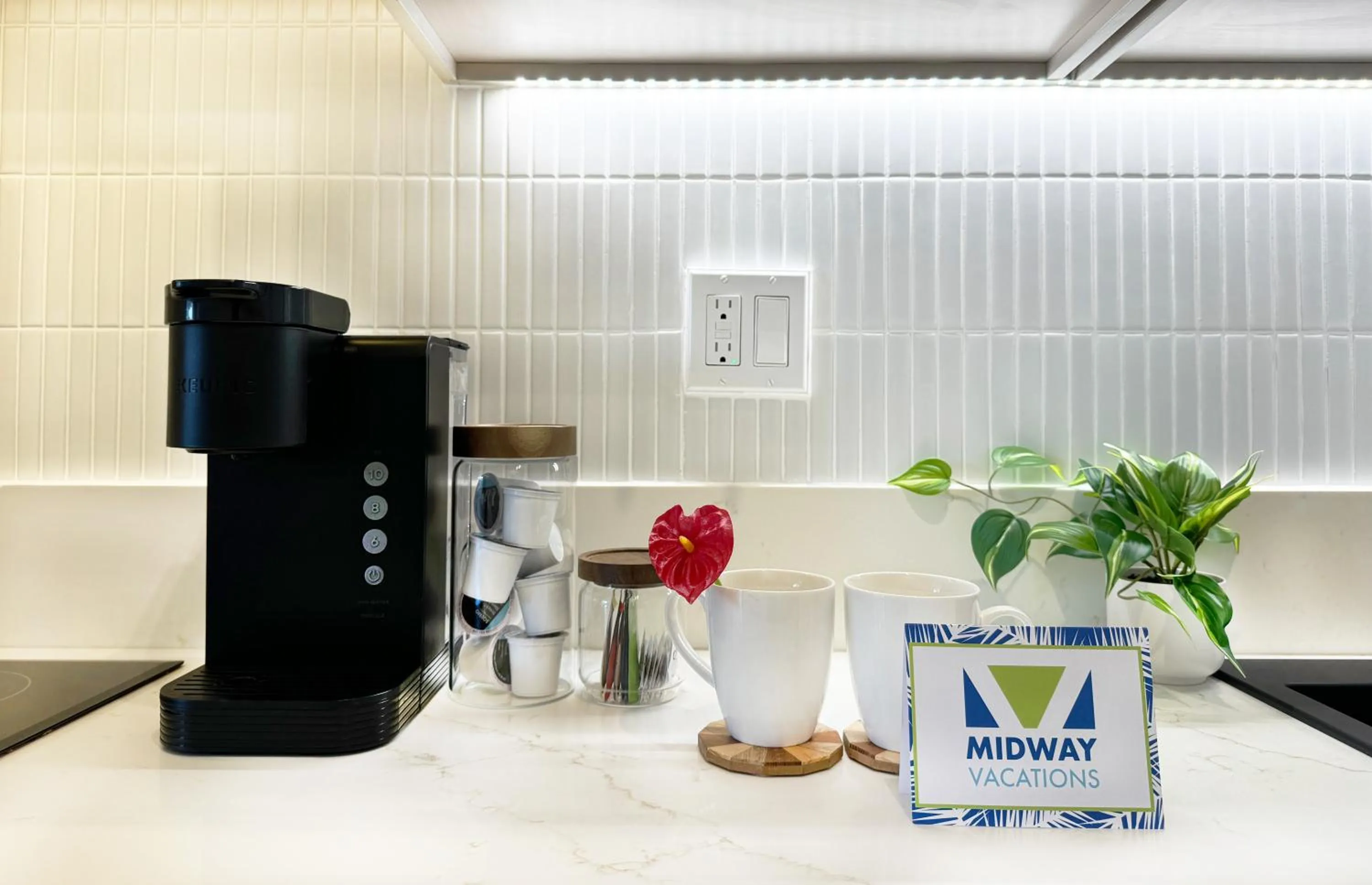 Kitchen or kitchenette in Steps to Waikiki Beach! Newly Renovated with 75" TV