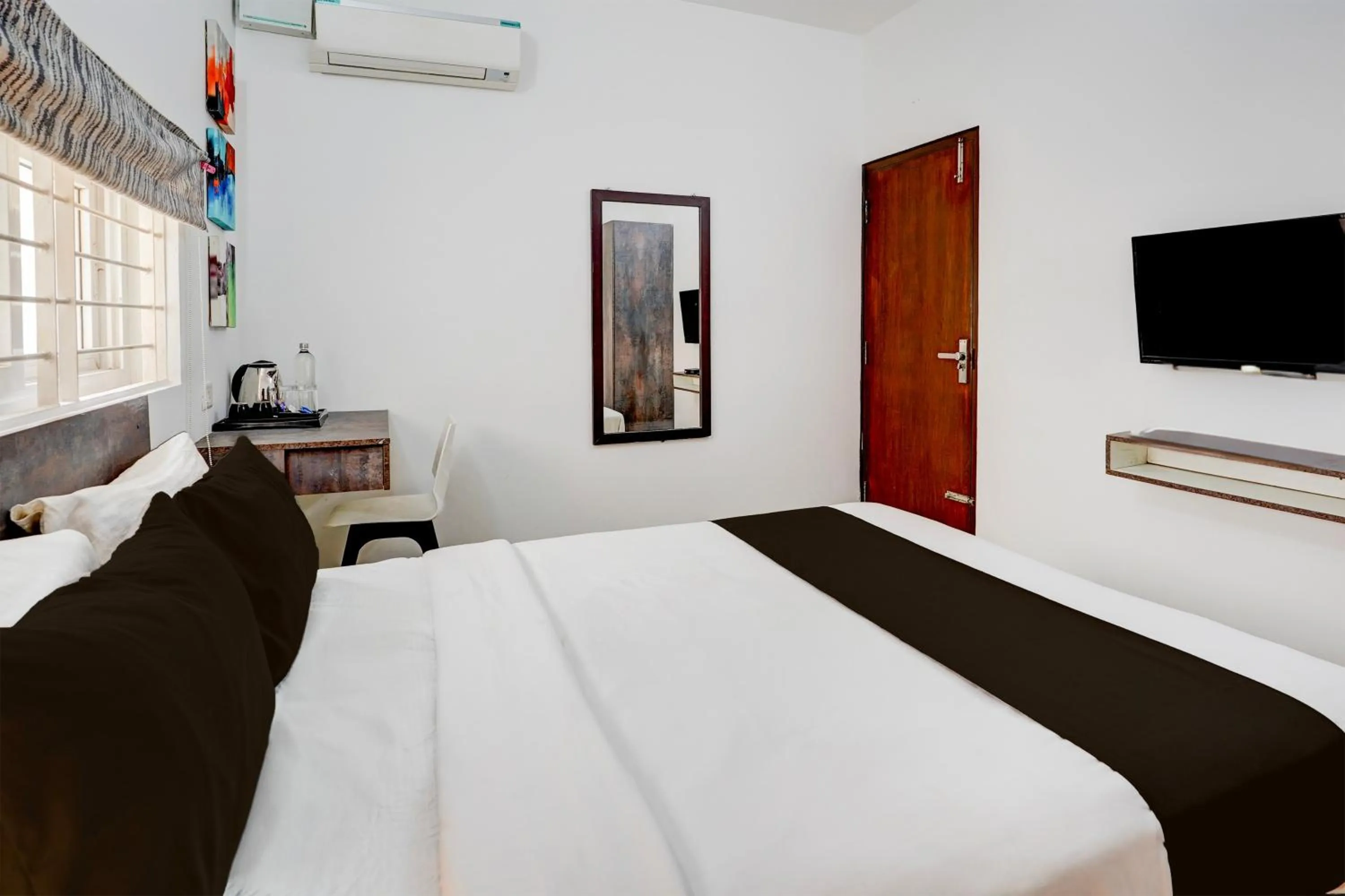 Bedroom, Bed in Super Townhouse Hebbal