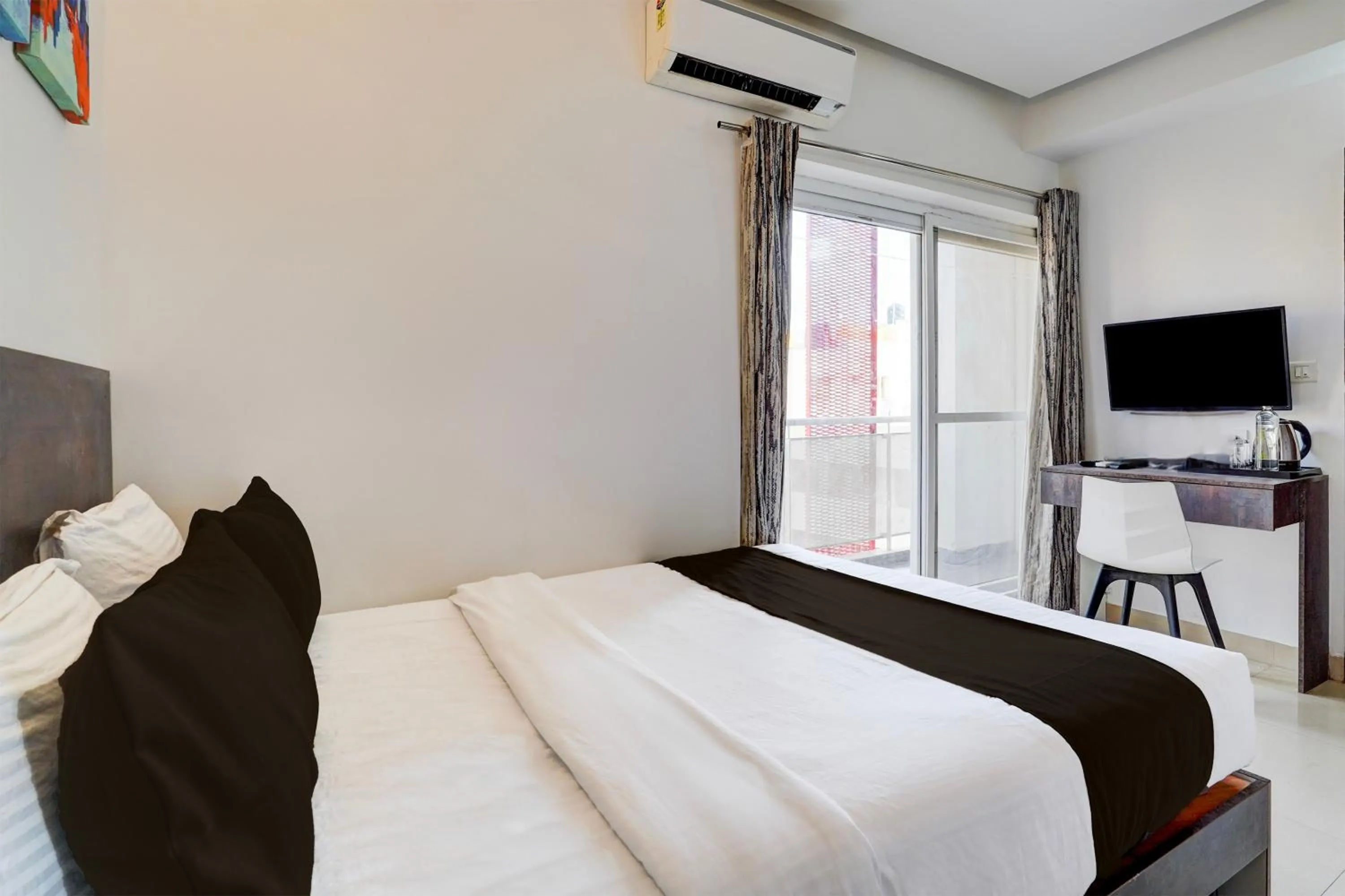 Bedroom, Bed in Super Townhouse Hebbal