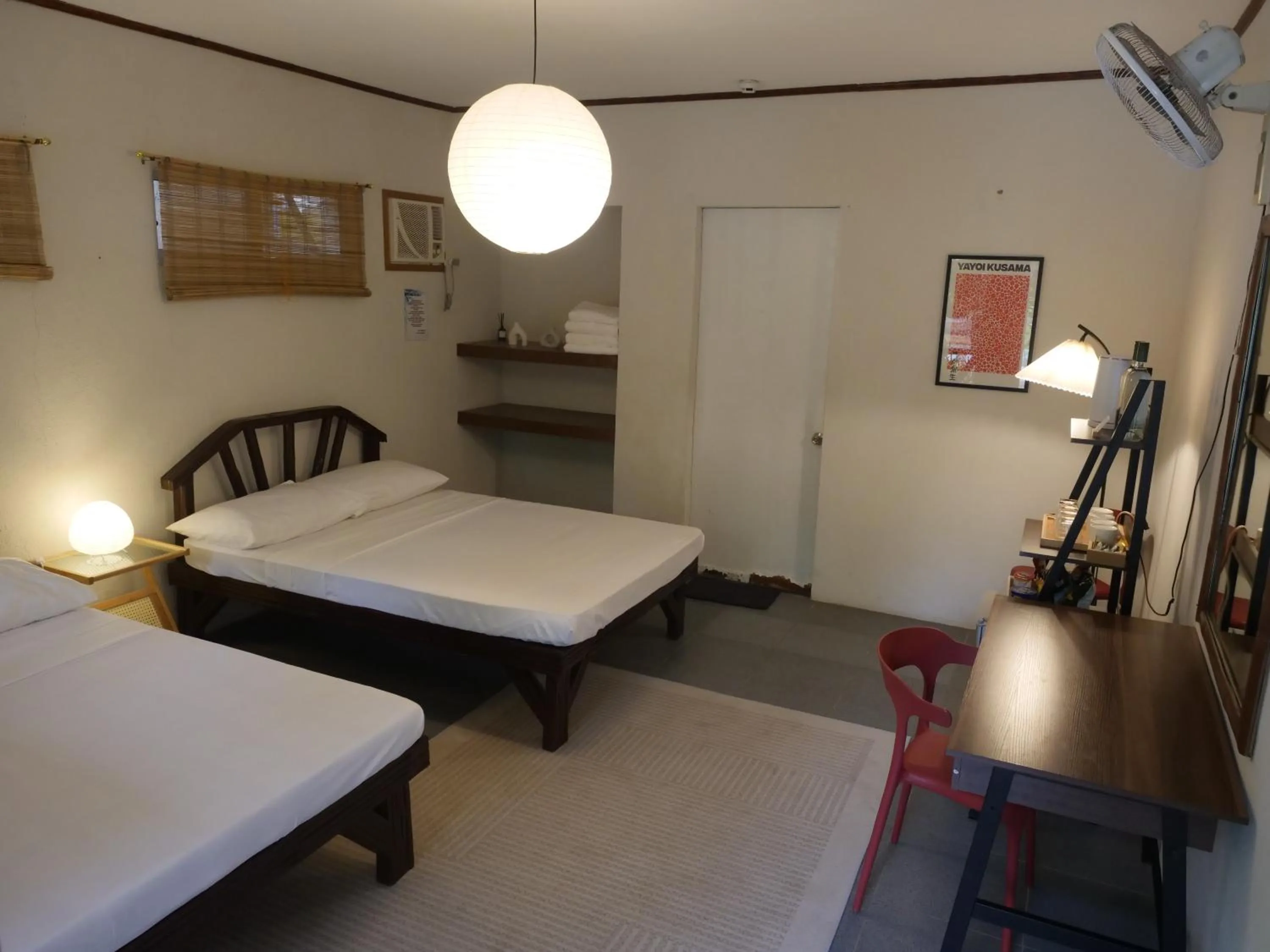 Bed in The Shark's Tail Dive Resort