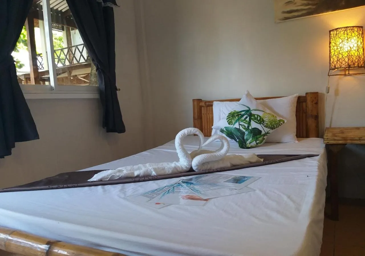 Bed in The Shark's Tail Dive Resort