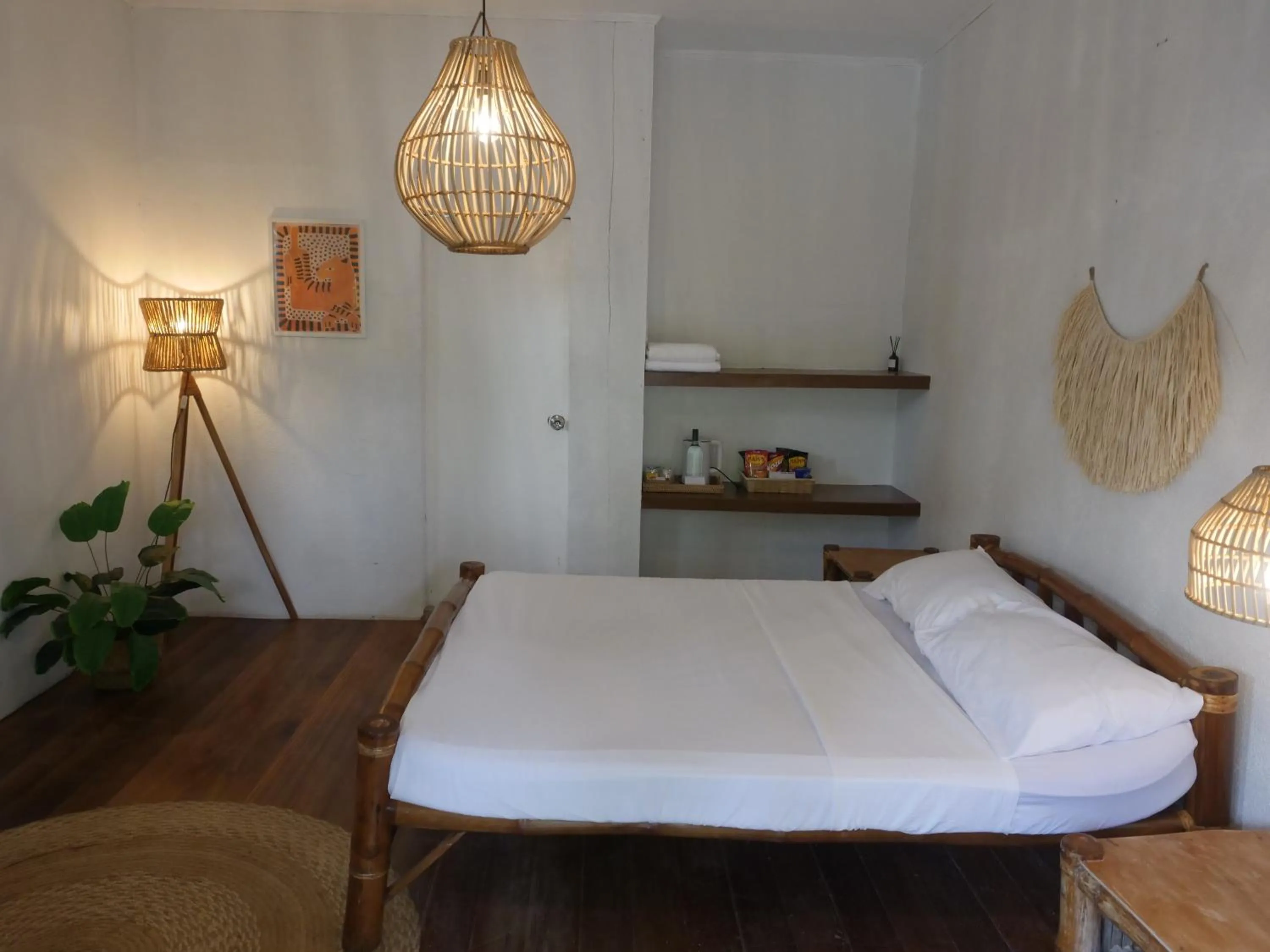 Bed in The Shark's Tail Dive Resort