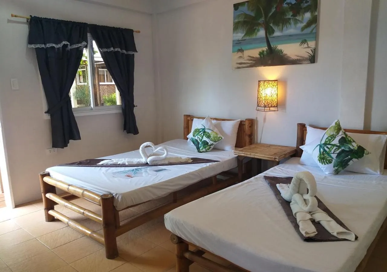 Bed in The Shark's Tail Dive Resort