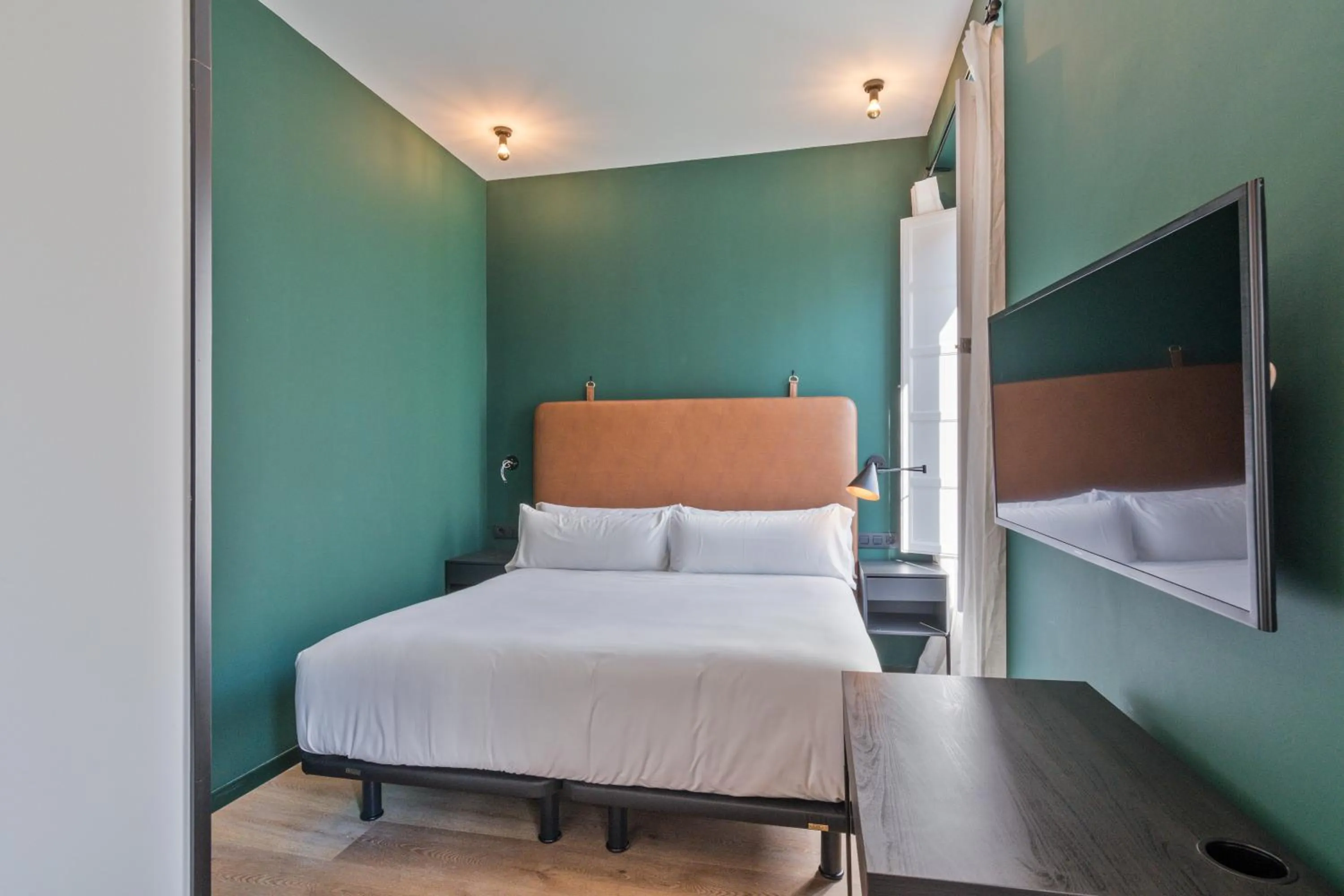 Bed in Uma Suites Atocha