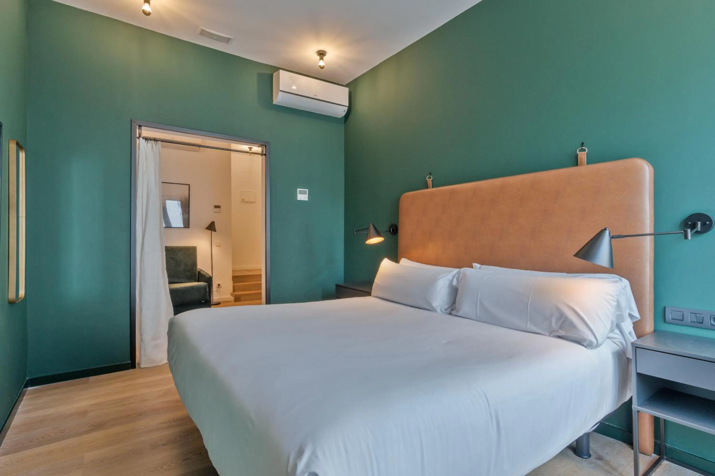 Bed in Uma Suites Atocha