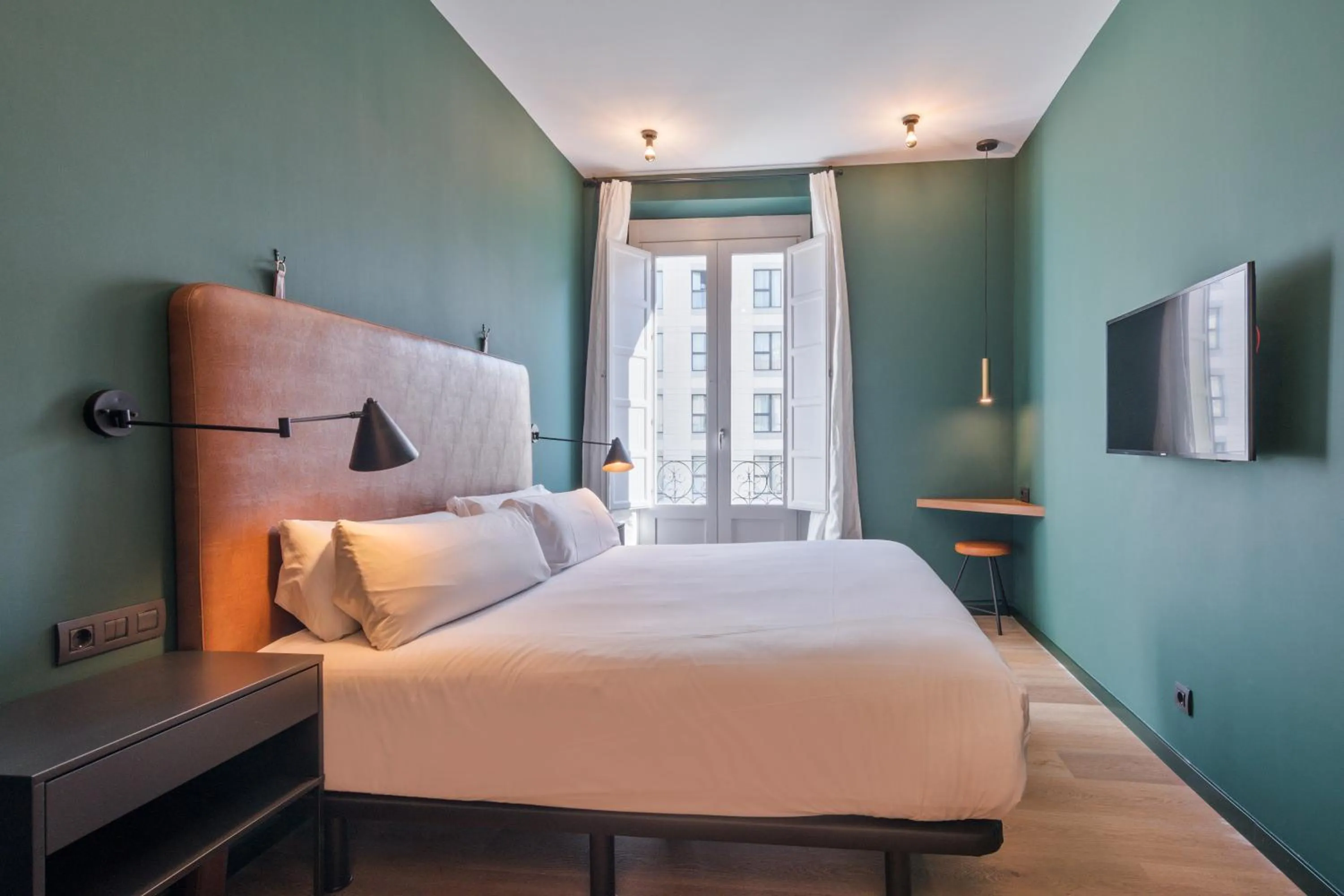 Bed in Uma Suites Atocha