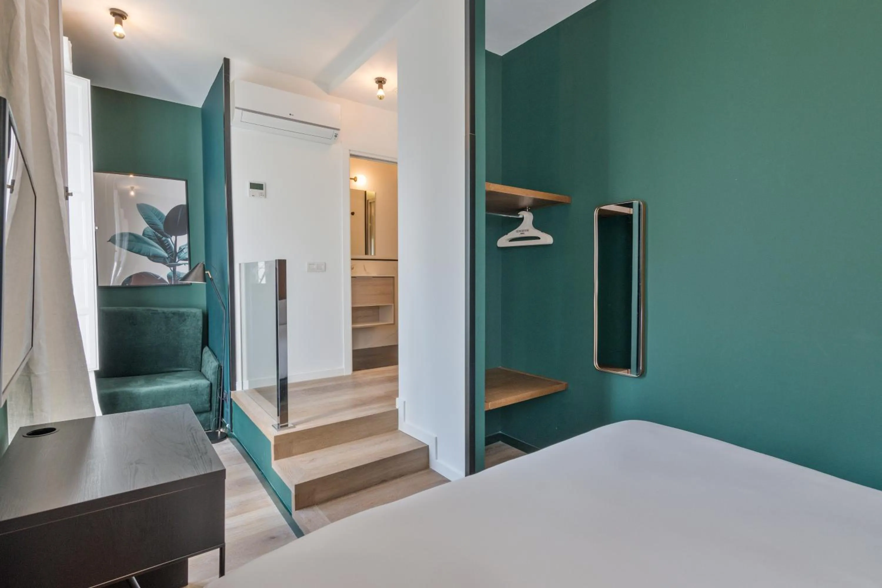 Bed in Uma Suites Atocha