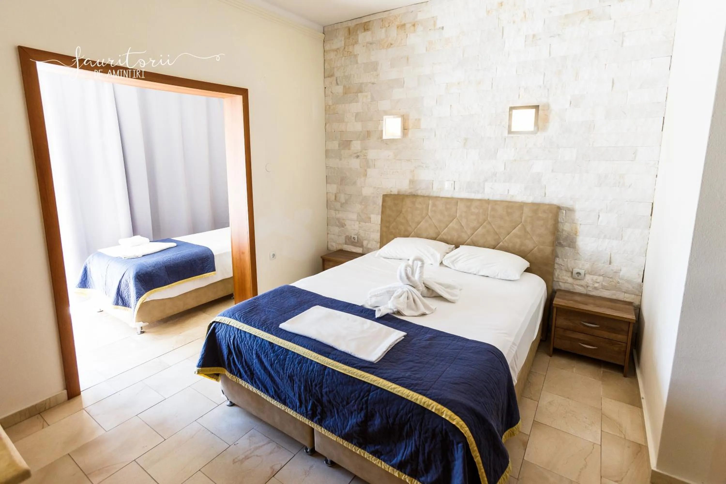 Bed in Kinira Beach Hotel