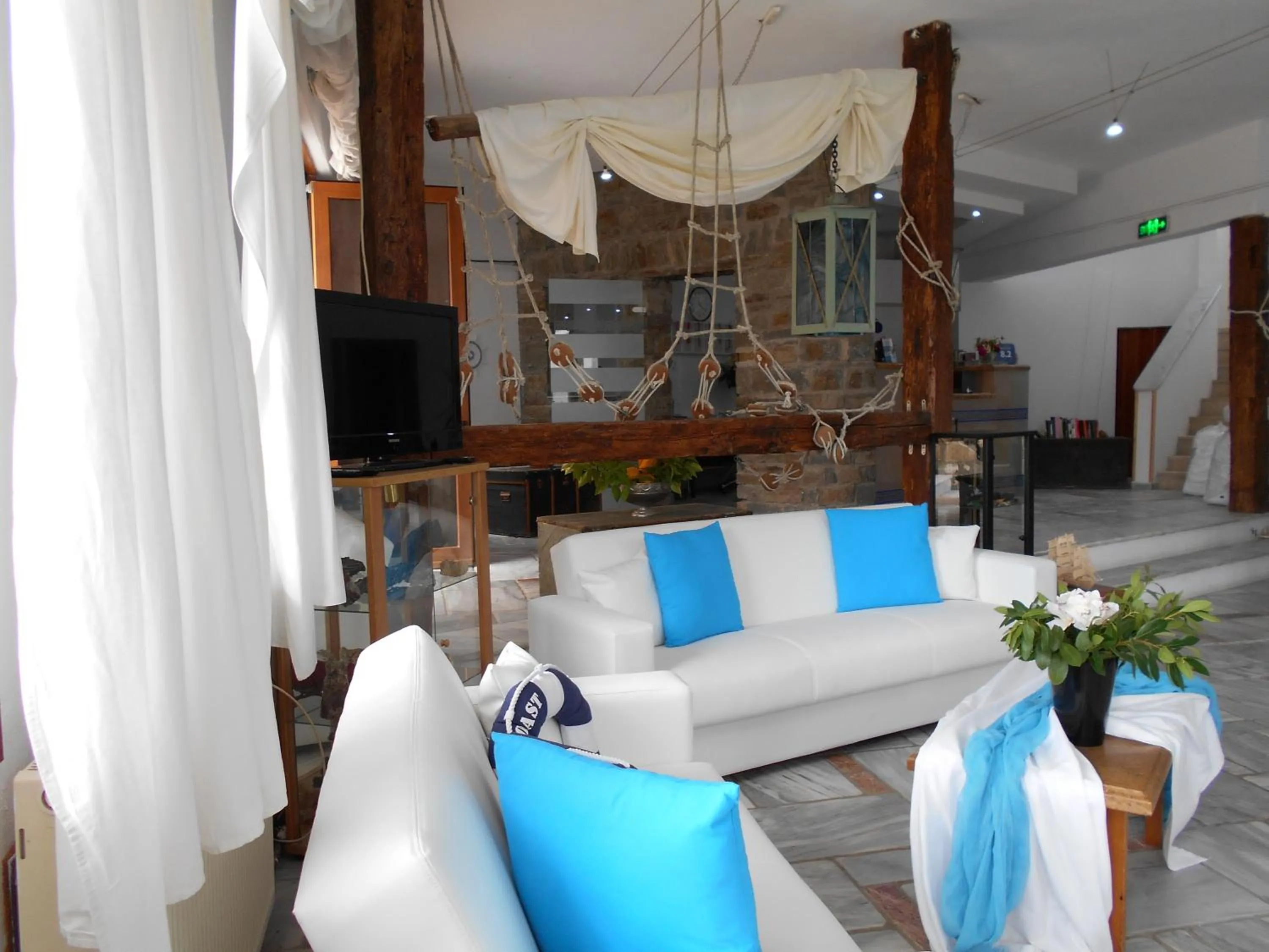 Communal lounge/ TV room in Kinira Beach Hotel