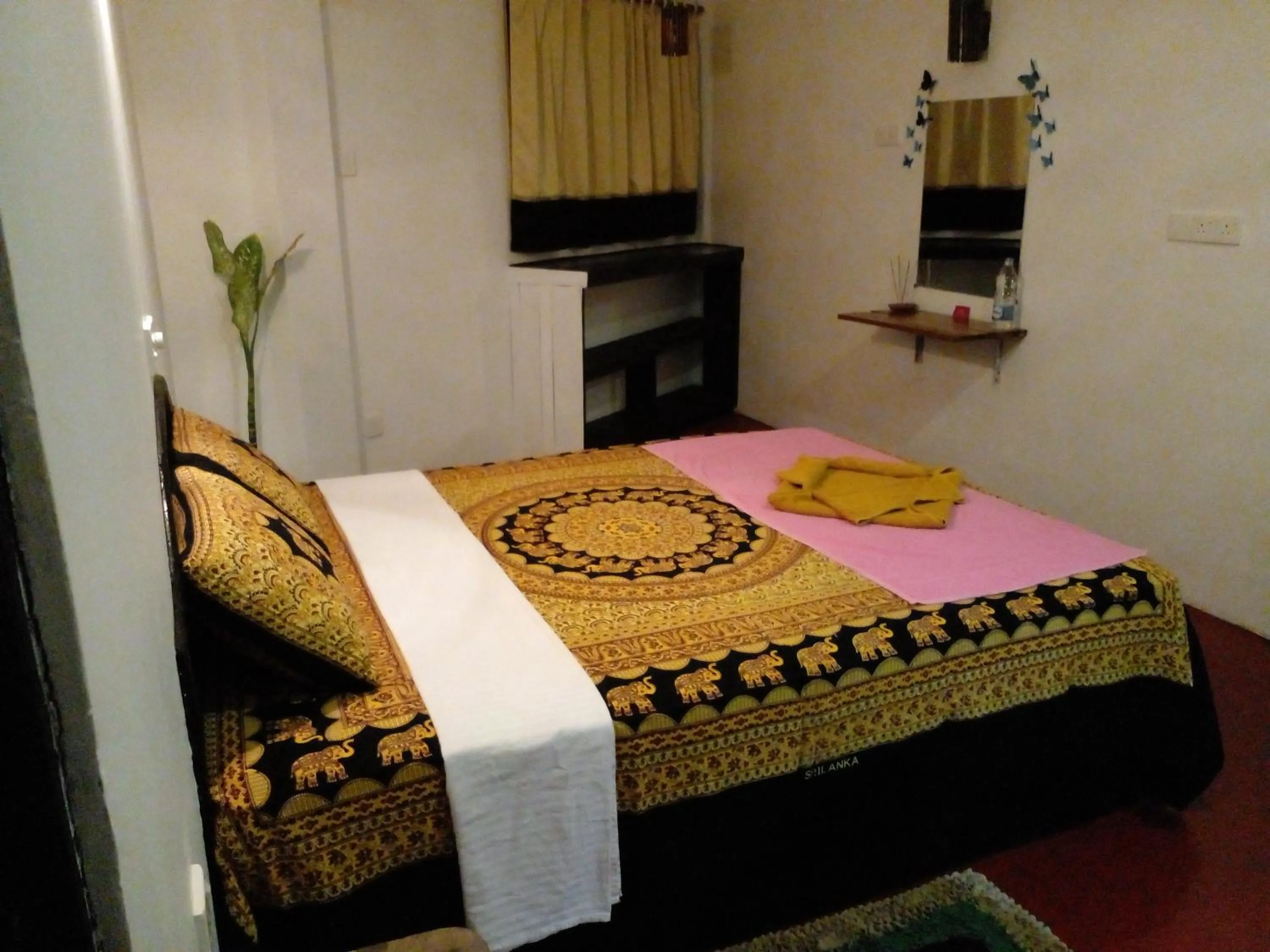 Bed in Malika's Yellow House