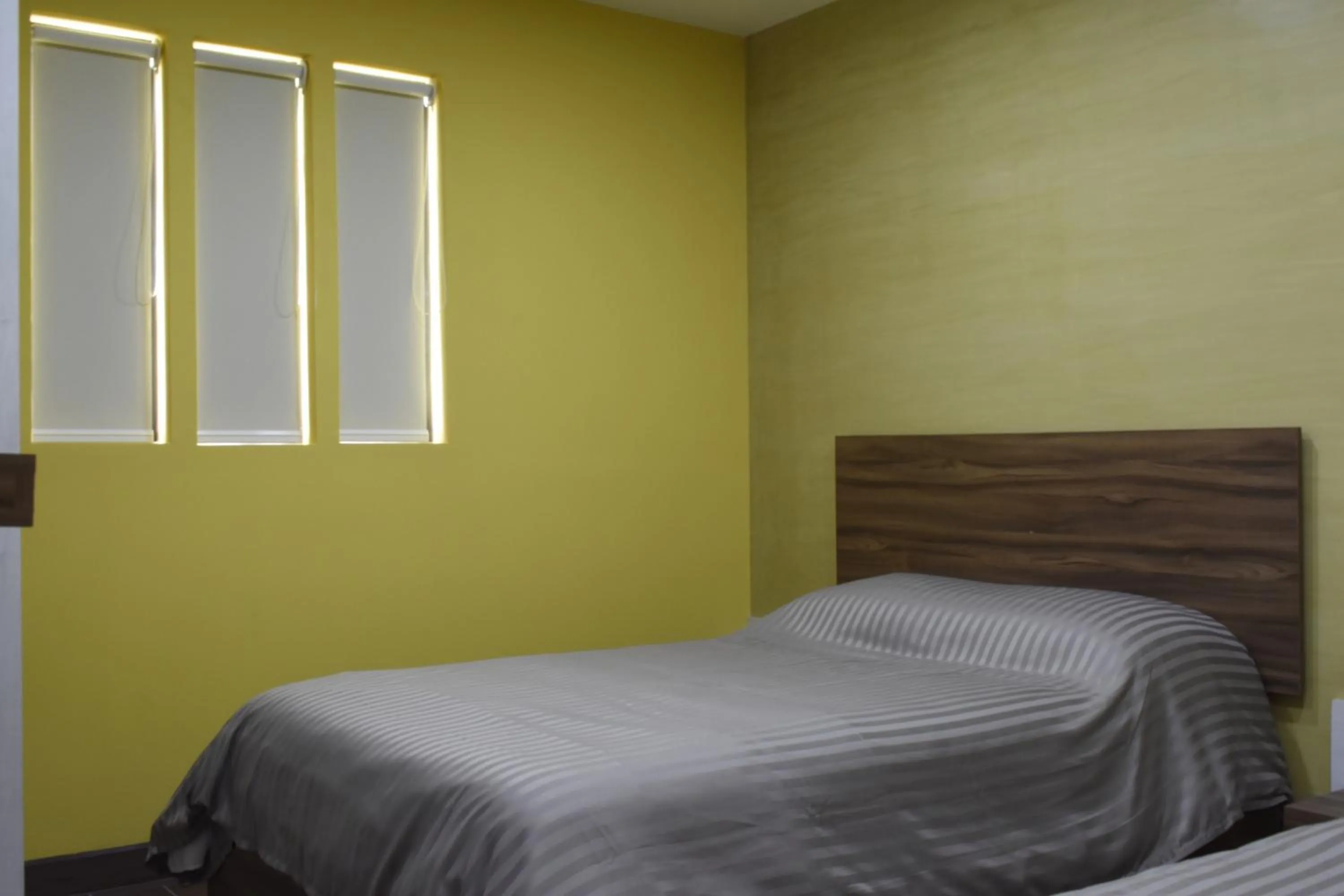 Bed in TJ Border Suites by Hosted by Me