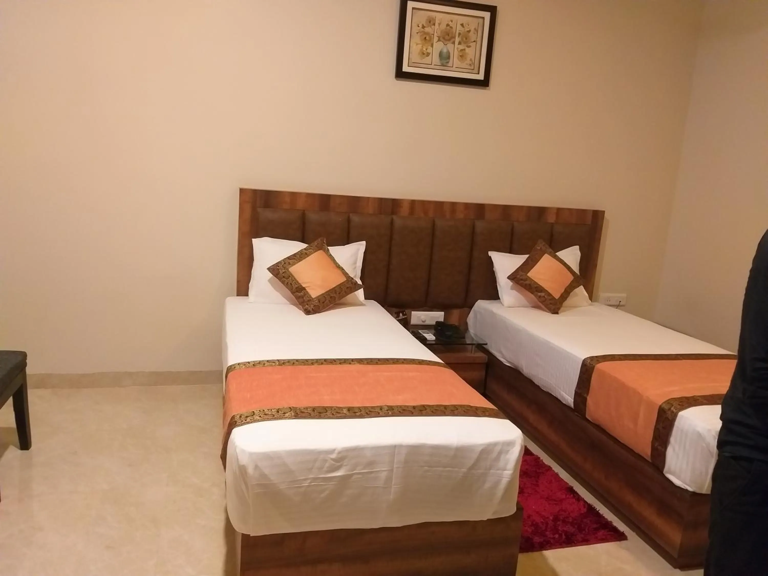 Bed in Hotel Radiance Courtyard