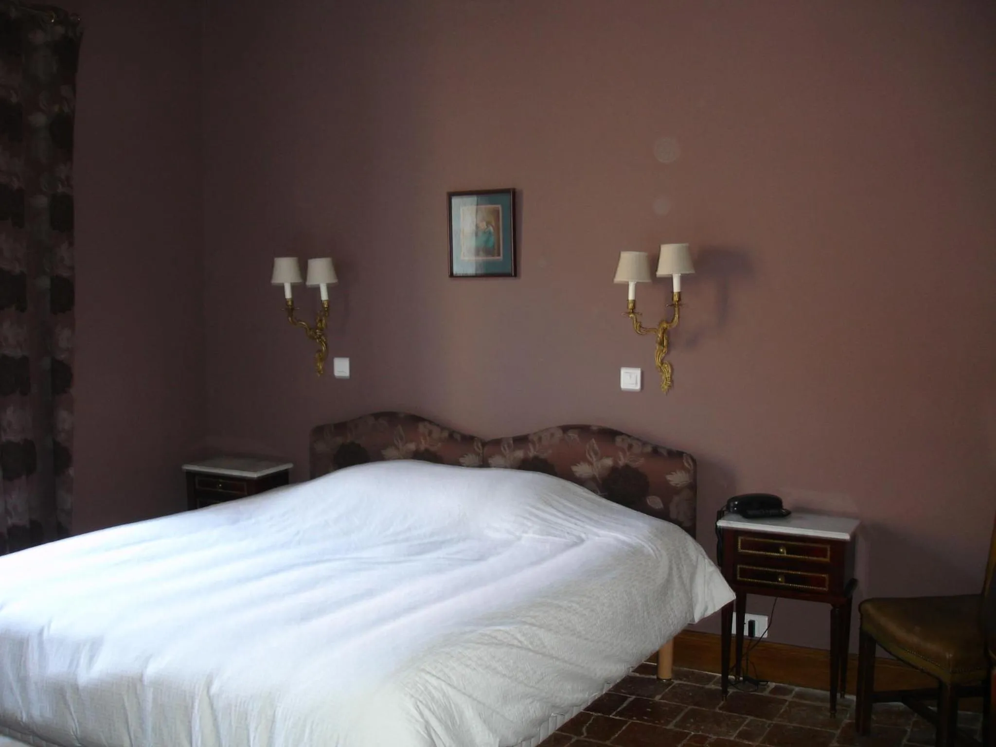 Bed in Le Relais du Lyon d'Or