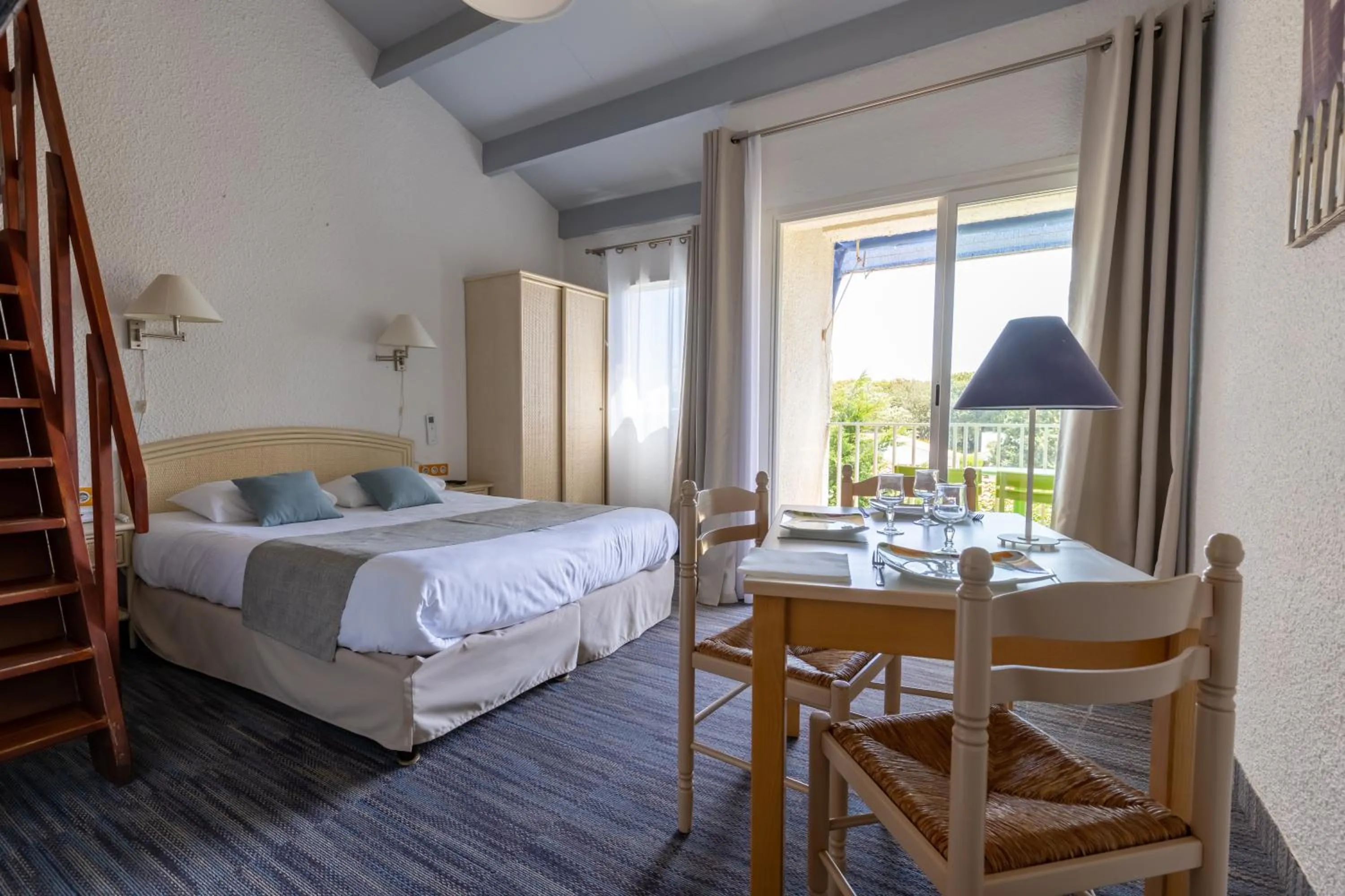 Bed in Logis Hôtel de la Plage