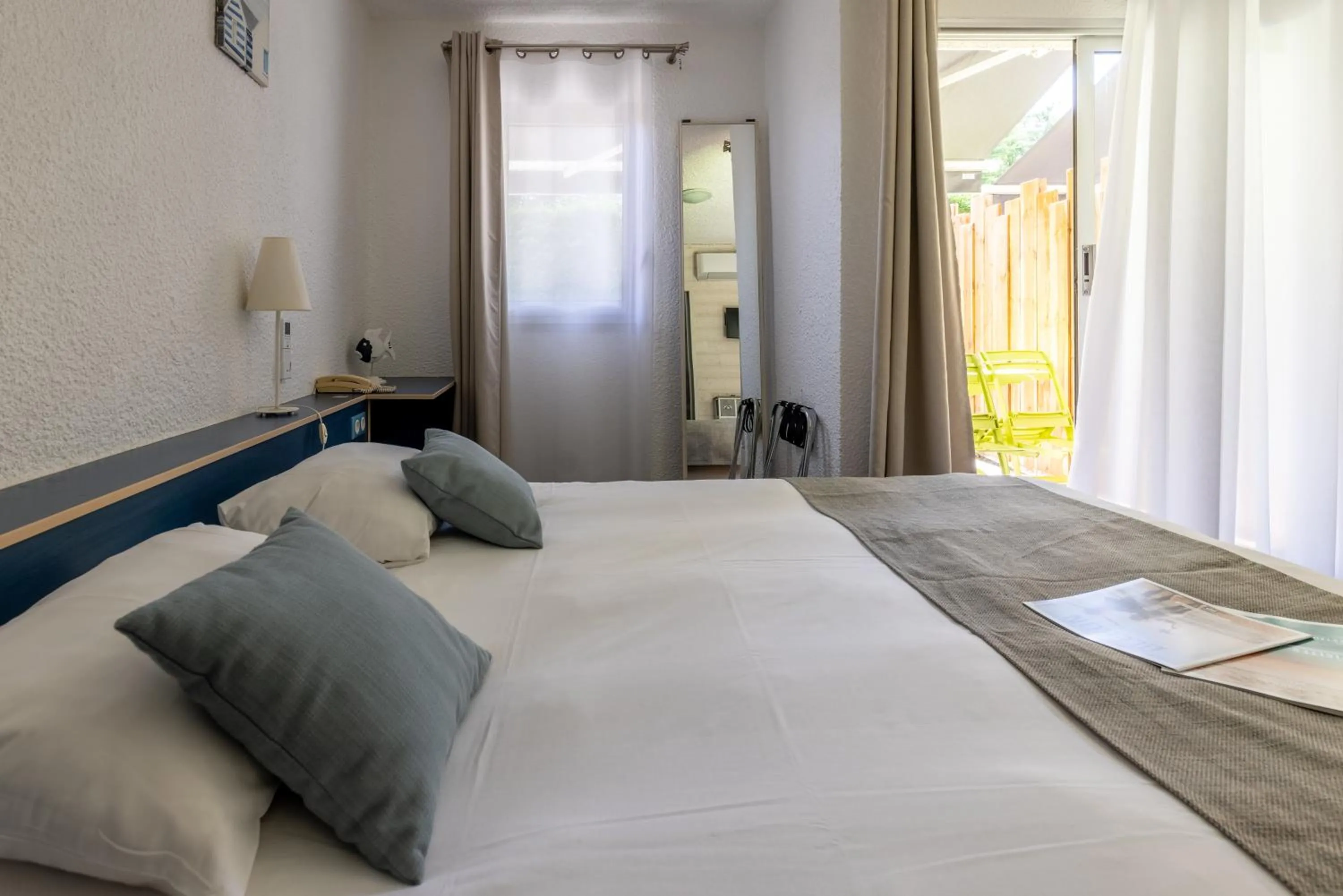 Bed in Logis Hôtel de la Plage
