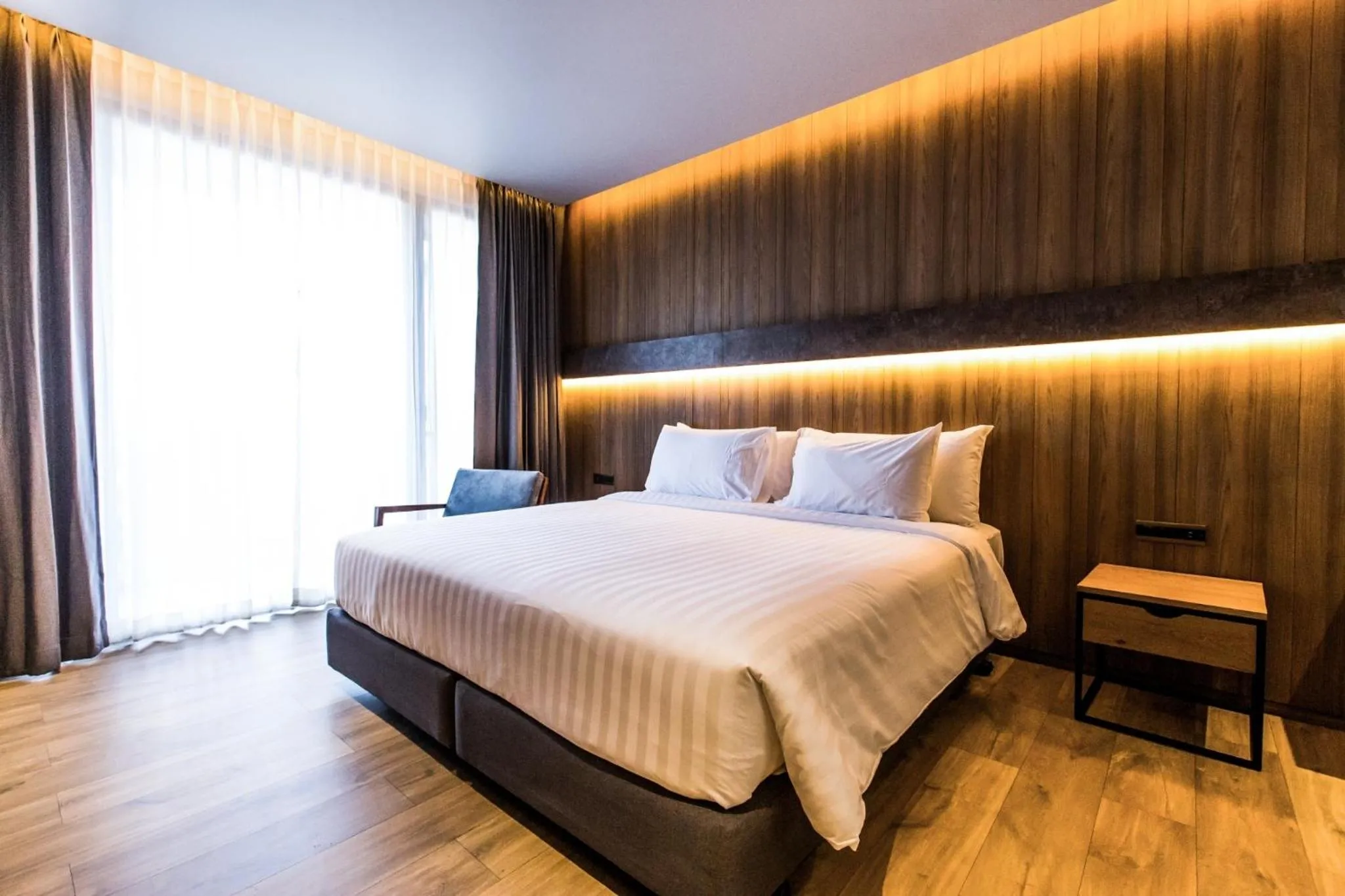 Bed in The Teak Hotel