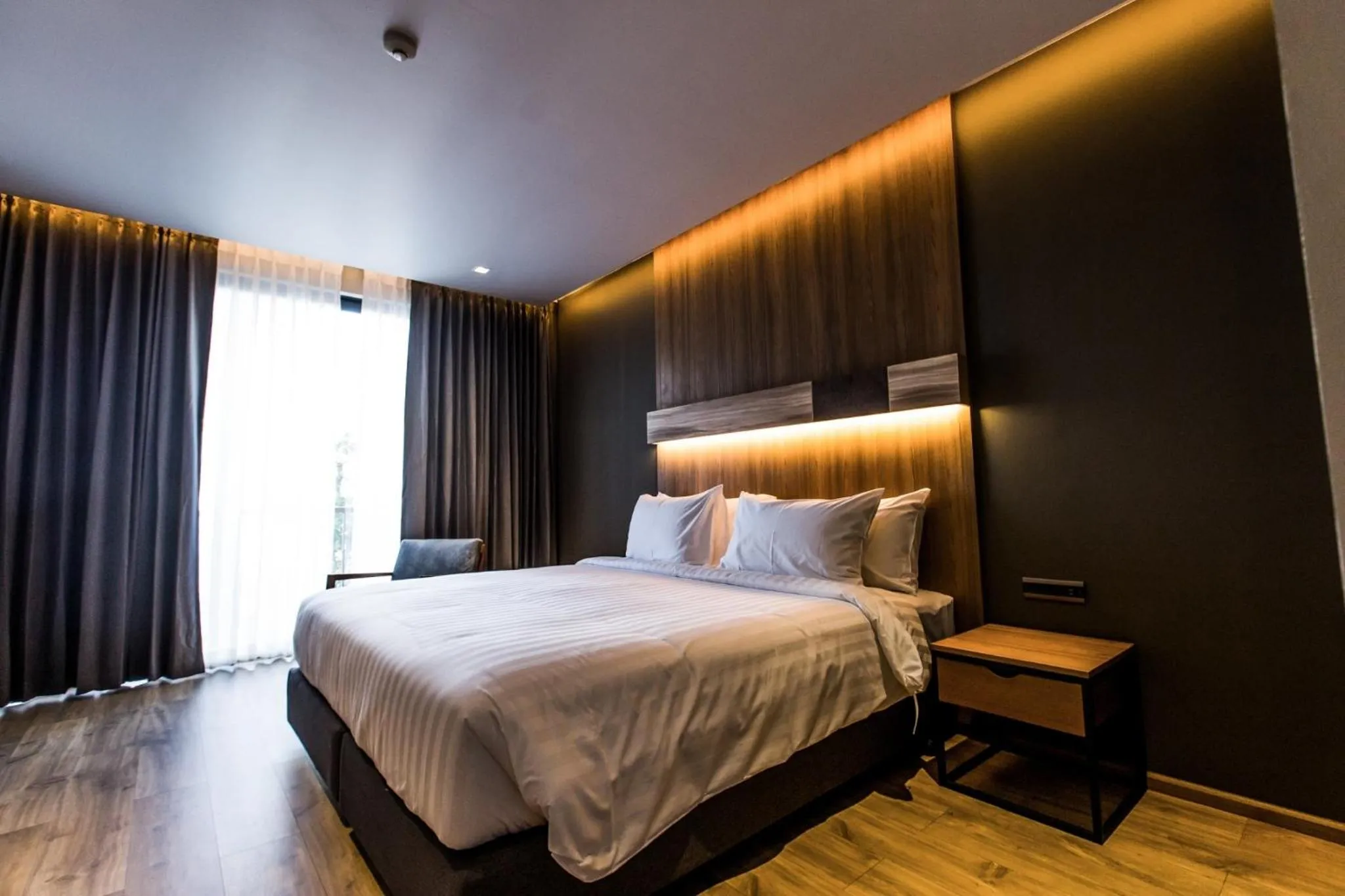 Bed in The Teak Hotel