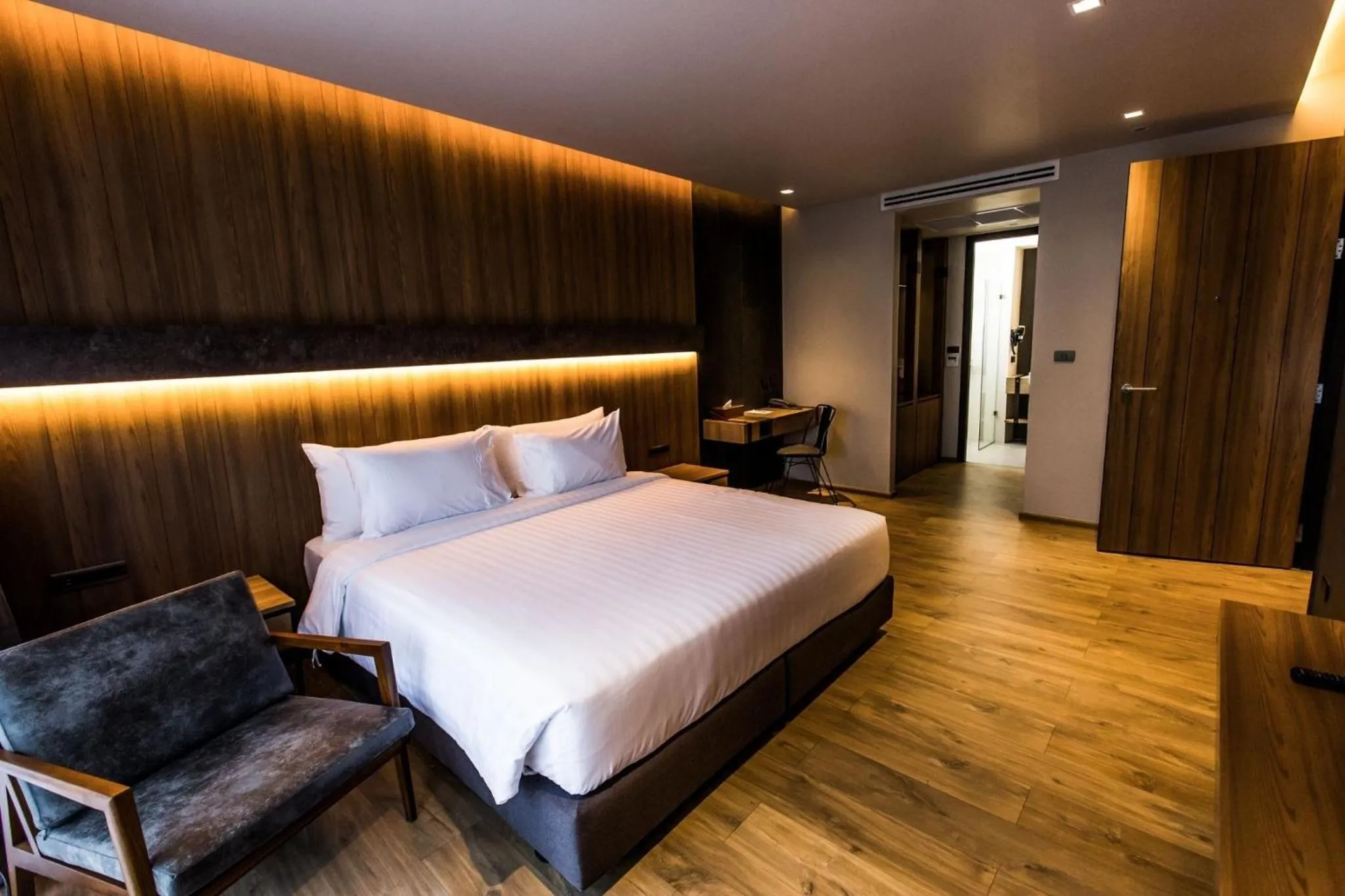 Bed in The Teak Hotel