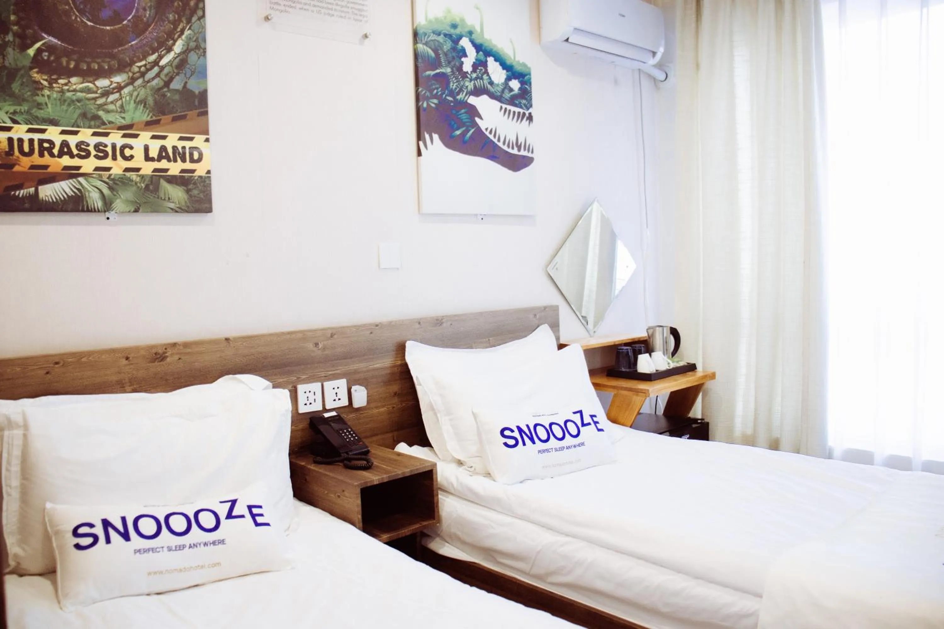 Bed in Nomado Boutique Hotel