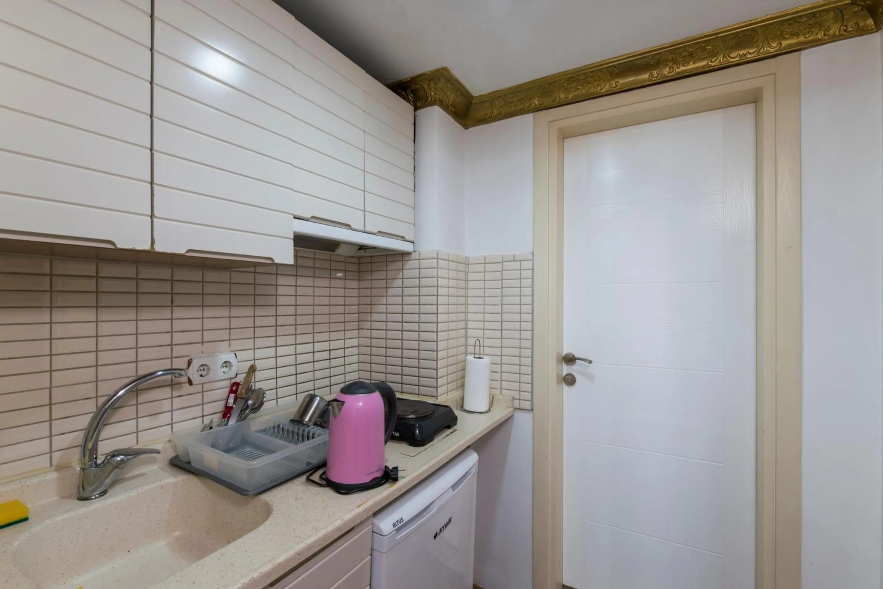 Kitchen or kitchenette in Punto Suite