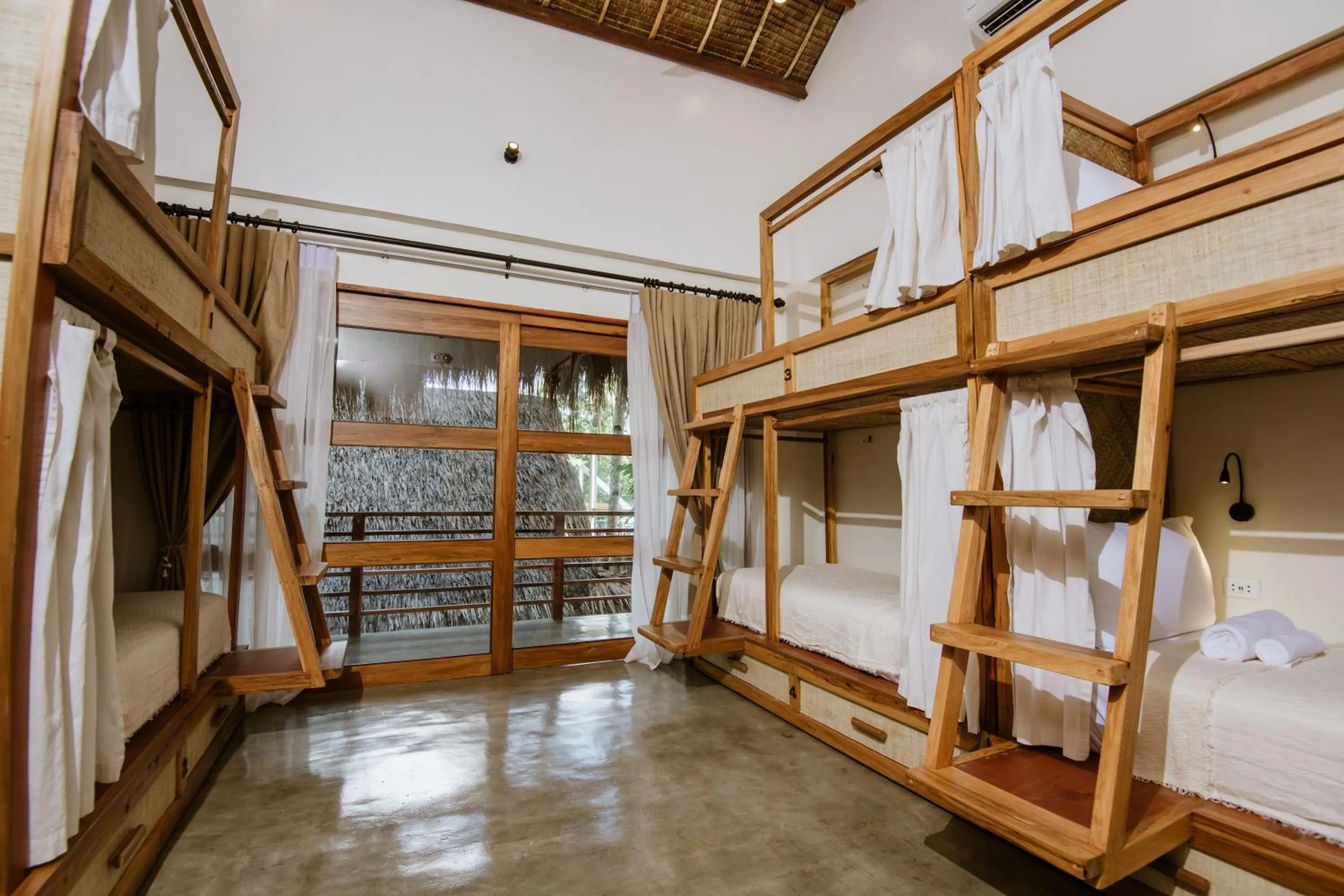 Photo of the whole room, Bed in Las Palmas Villas and Casitas Siargao